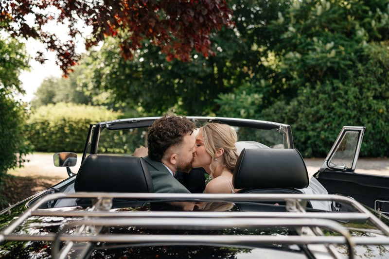 bride and groom in the car