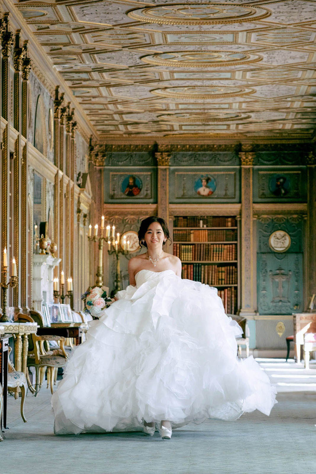 The radiant Hong Kong bride Sherri as she strolls through the historic Syon House in London on her wedding day.