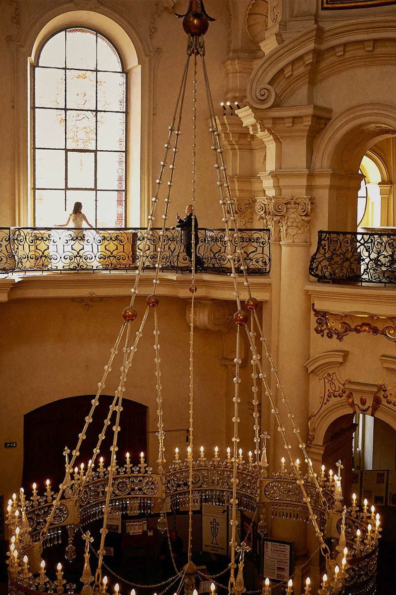 Korean bride above the chandelier in St. Nicholas Church, Prague