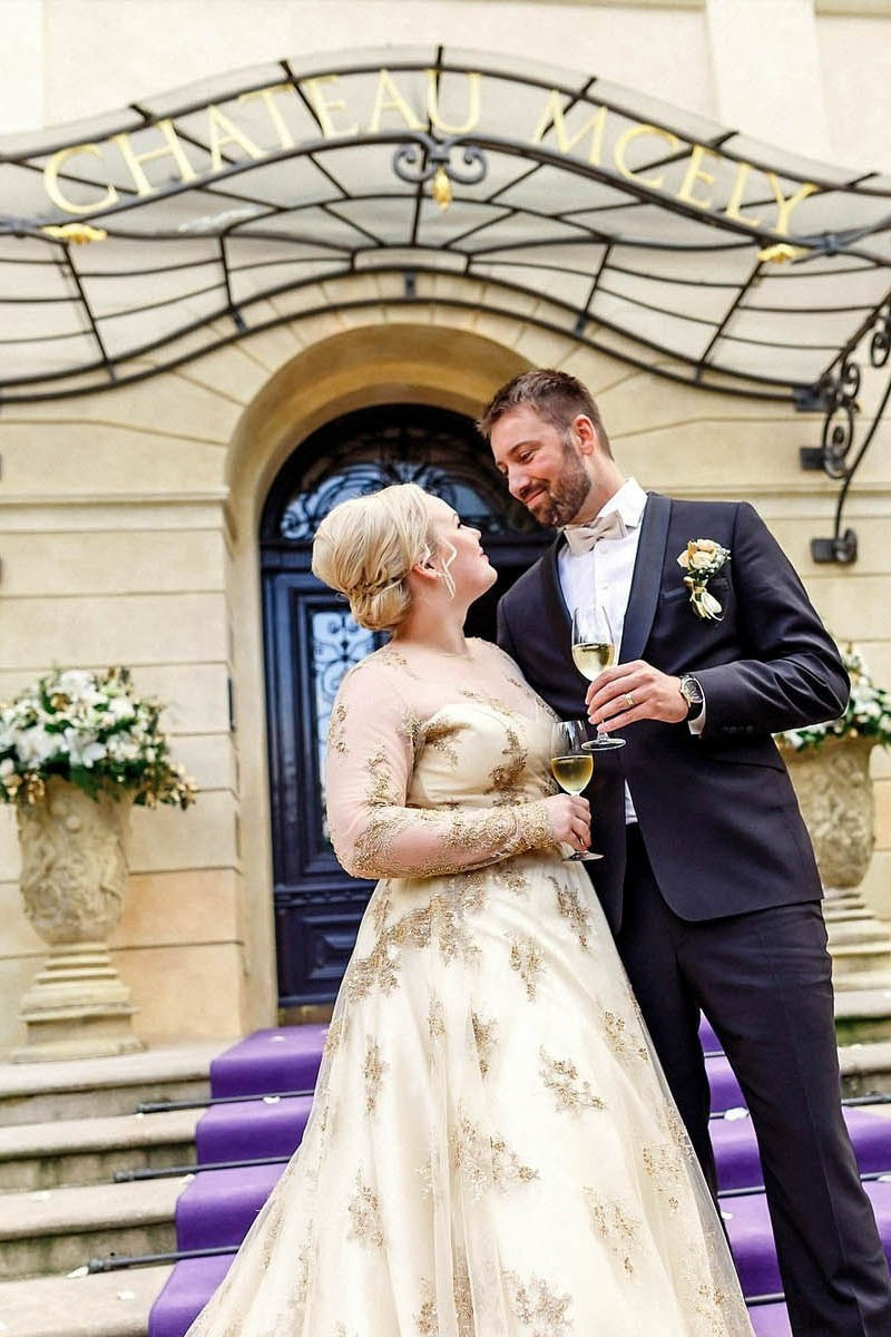 Blonde bride toasting groom with champagne, Chateau Mcely