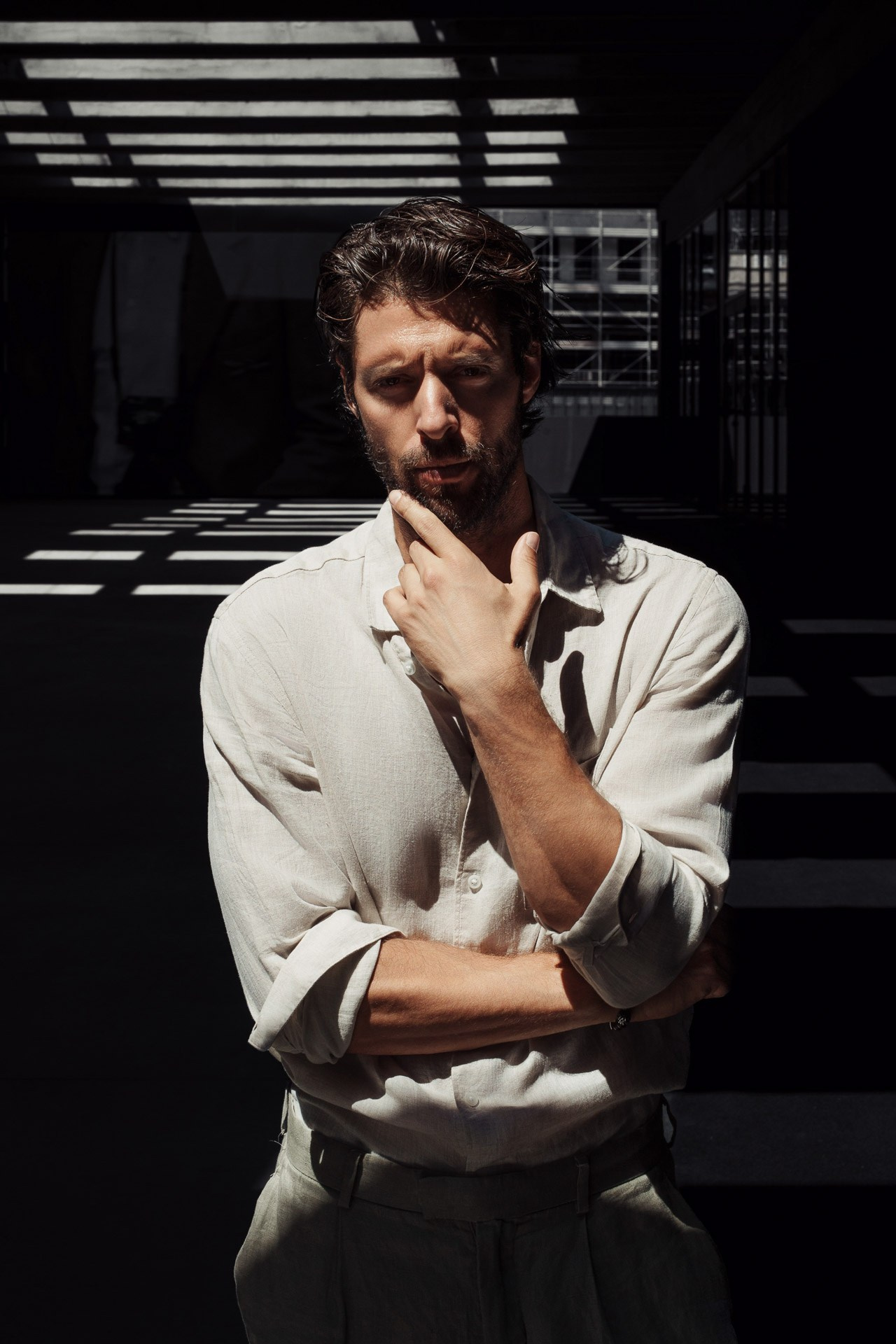 Male model portrait in sand-colored jacket during Milan photoshoot