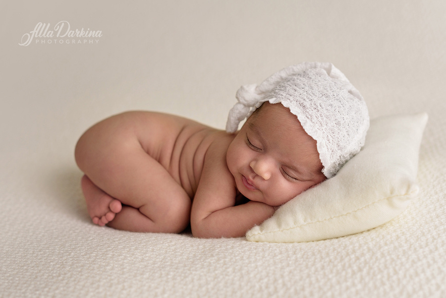 White lace beanie cute sleeping baby photograph.