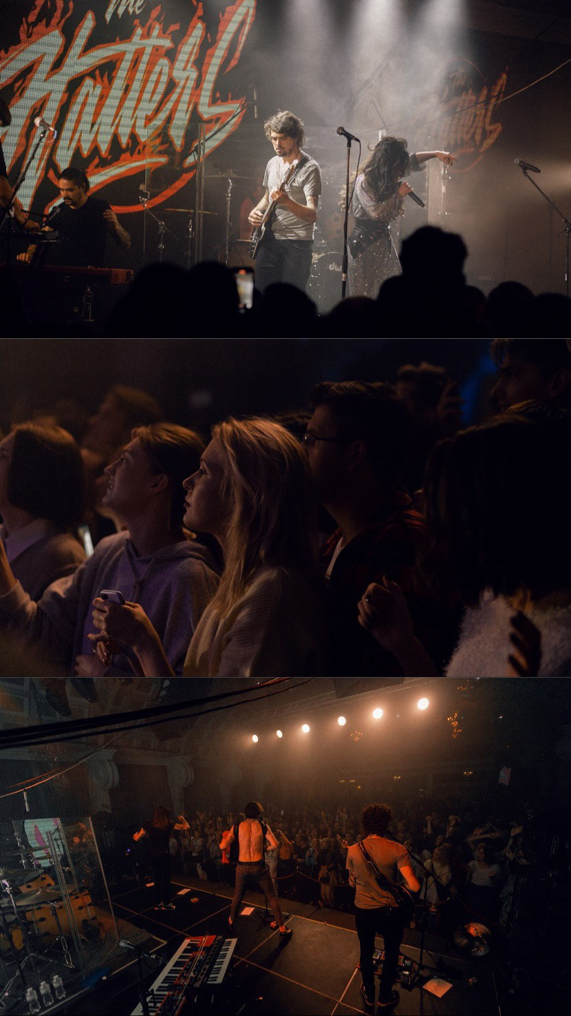 A close-up of a musician with a guitar under bright stage lights⁠