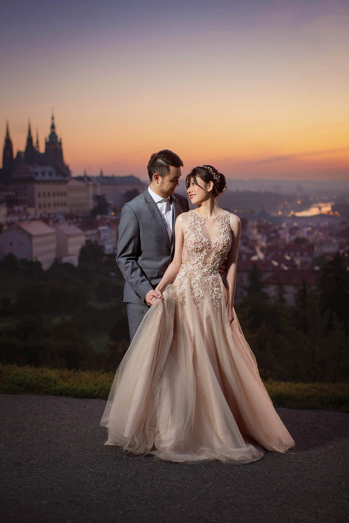 Malaysian couple viewed misty sunrise above Prague Castle, Petřín Hill vineyards