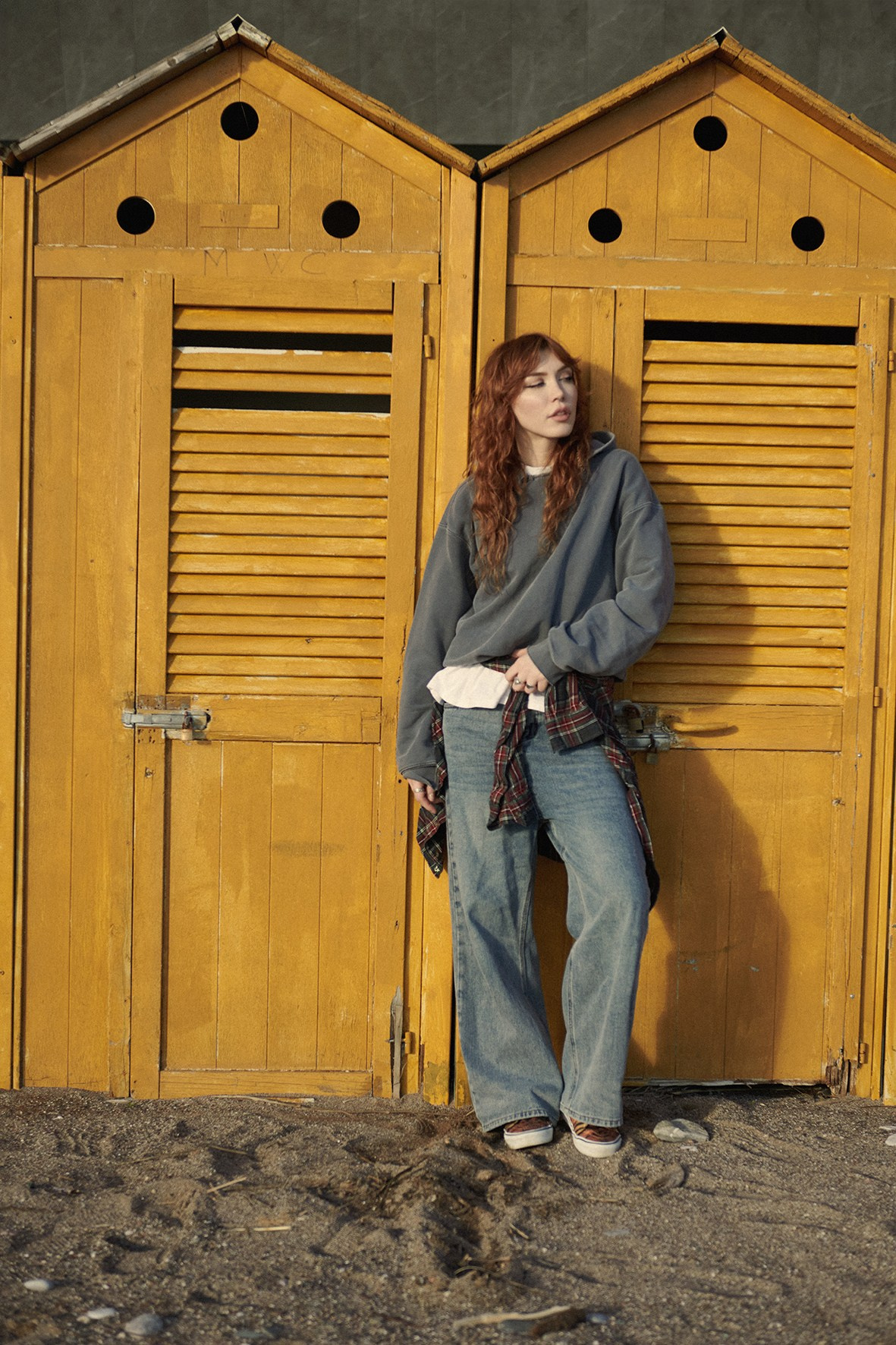 Fashion campaign for a clothing brand, photographed on a seashore in natural light