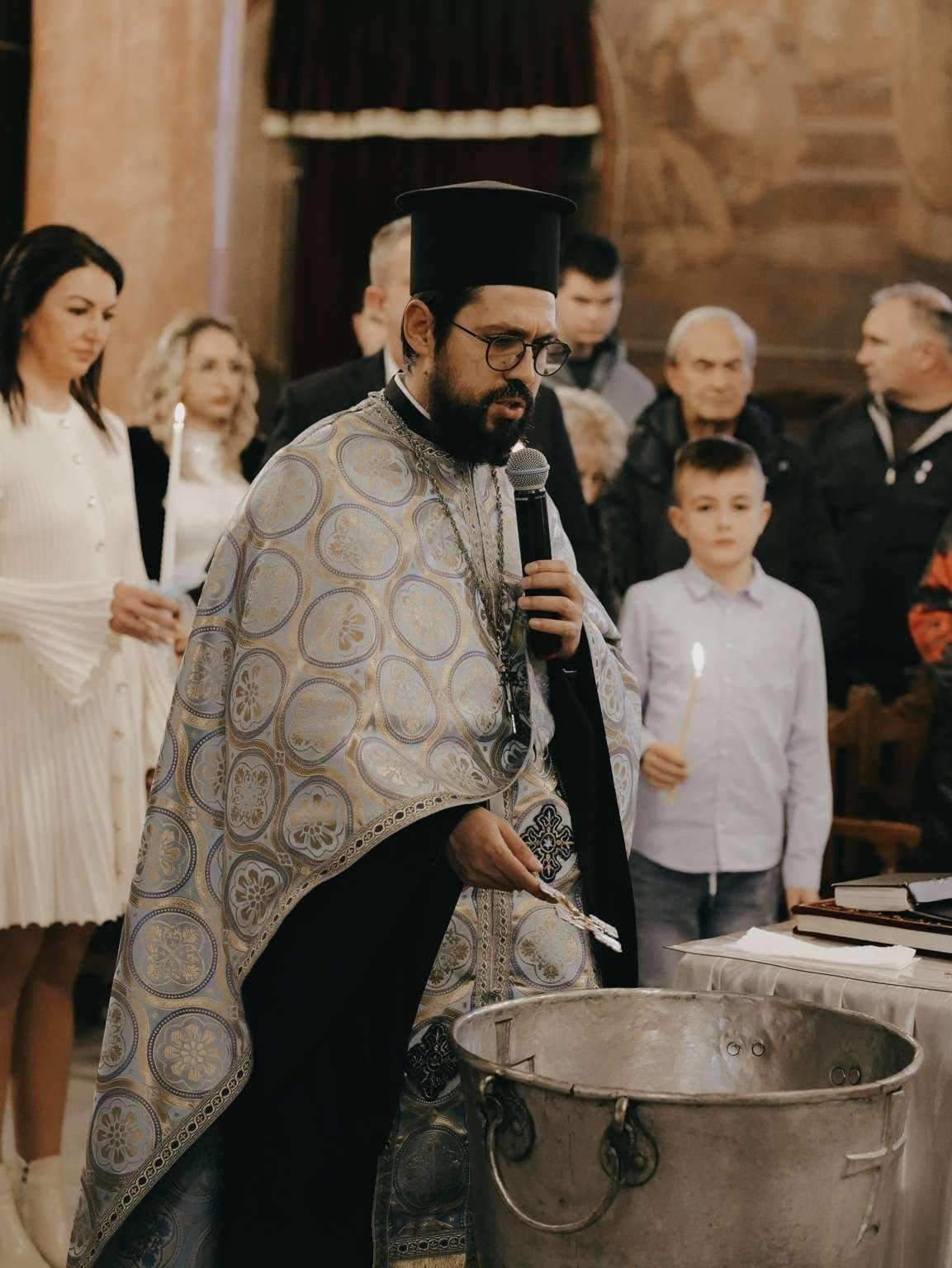 orthodox priest blessing baptism water family church
