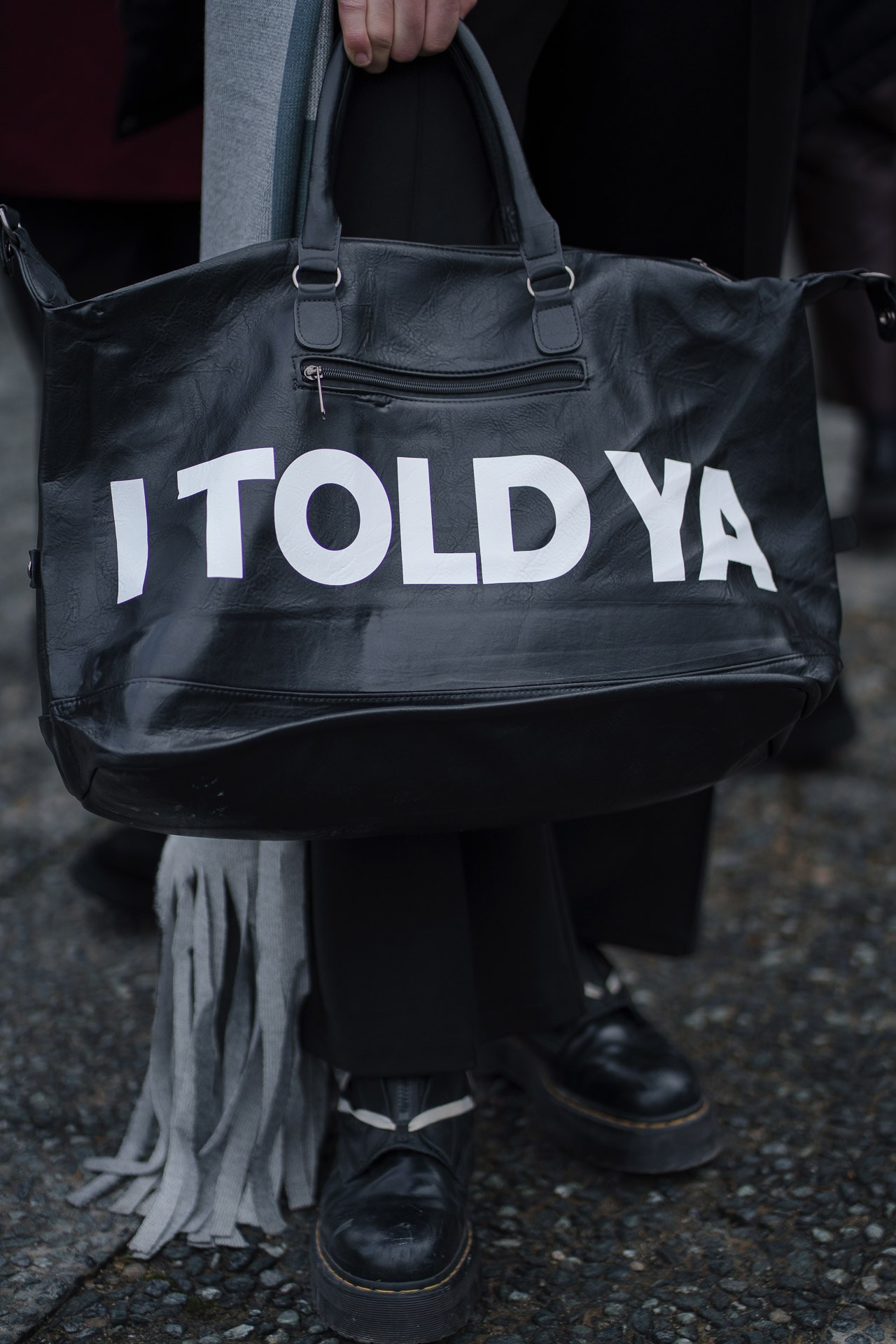 Close up of black leather bag with ITOLDYA logo at Pitti Uomo Florence