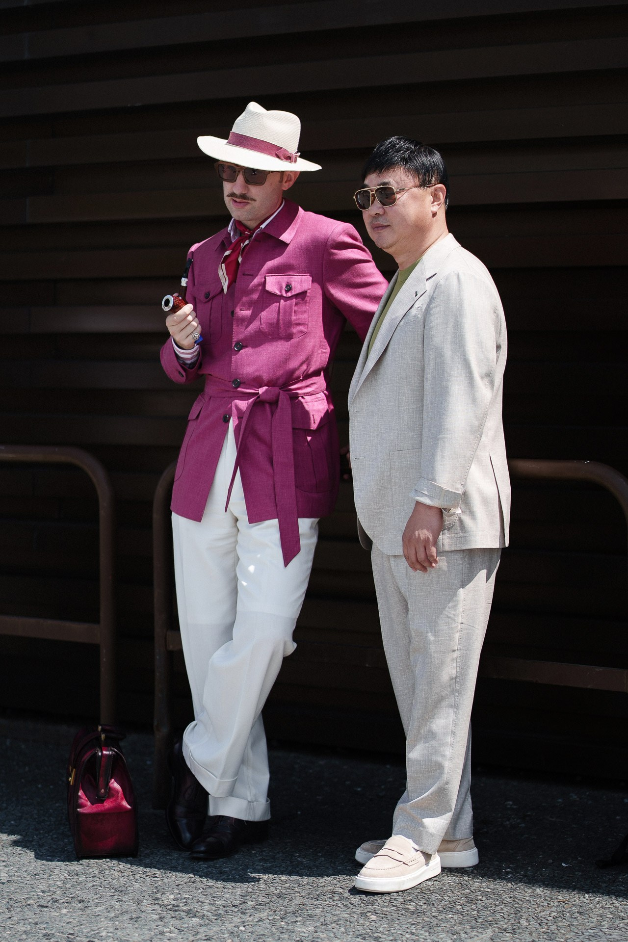 Menswear street style at Pitti Uomo 110, two guests in magenta and neutral tailored looks
