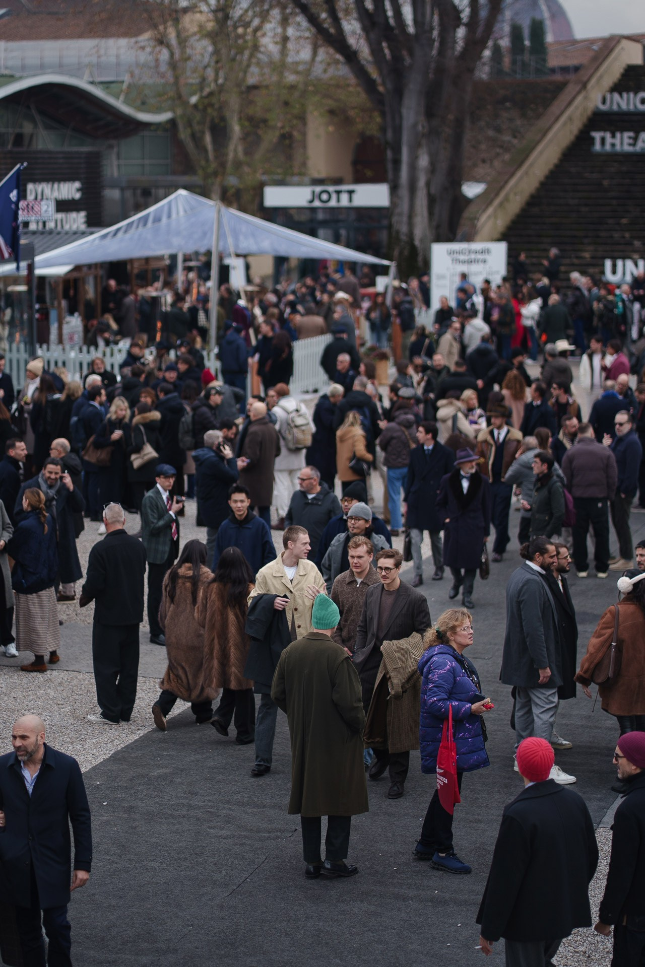 Crowd outside Pitti Uomo 109 in Florence showing fashion week atmosphere