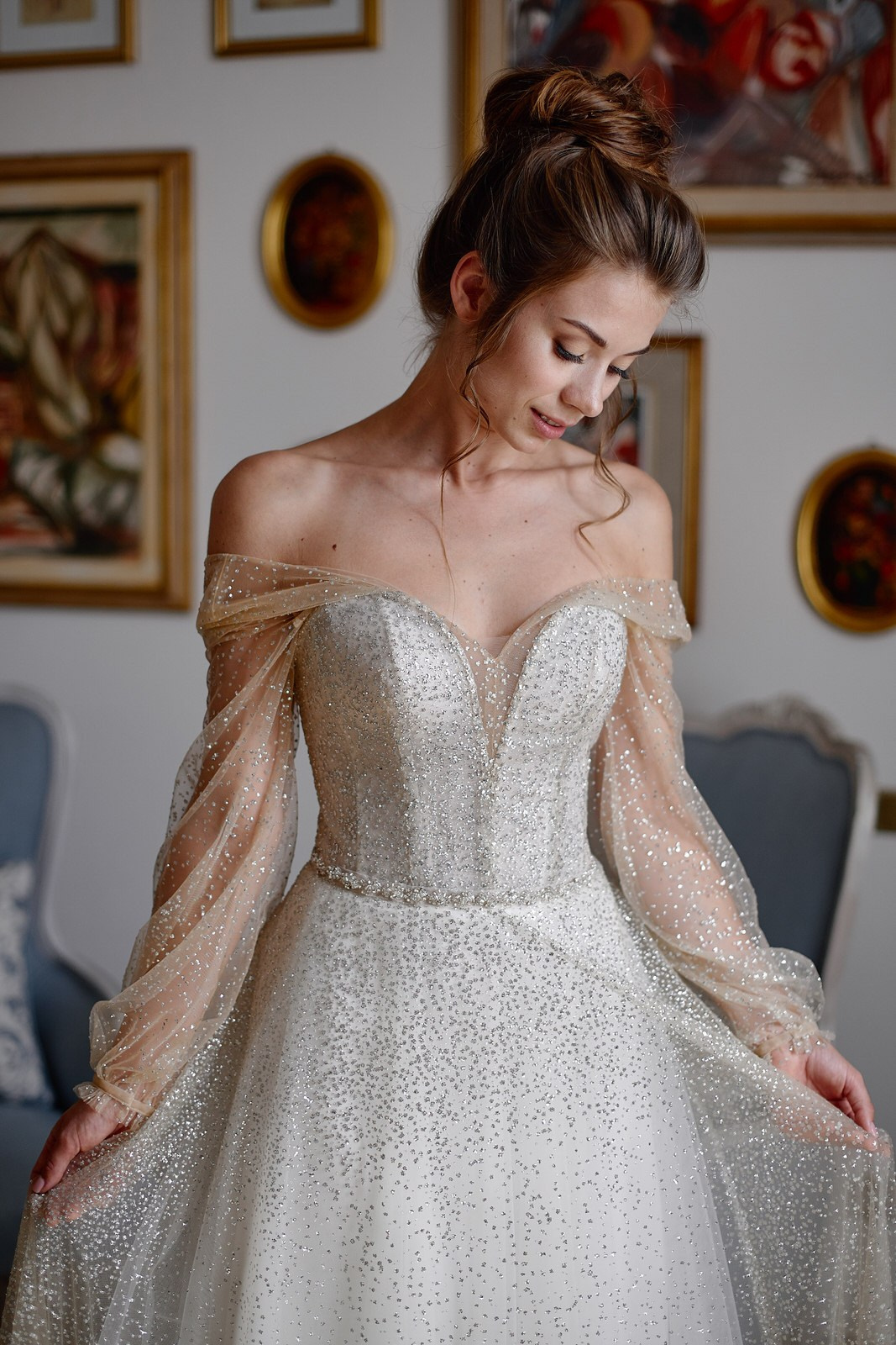 Bride getting ready in a sunlit room at Villa Barbara rustic stone agriturismo in Tuscany, surrounded by warm terracotta textures and wooden beams