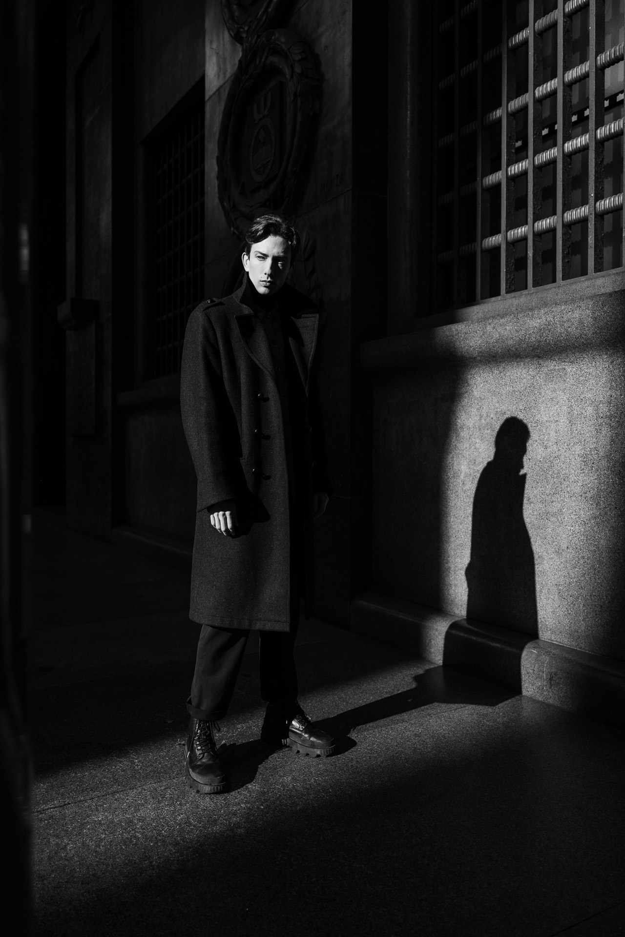 Black and white personal portrait photoshoot in Milan with dramatic light