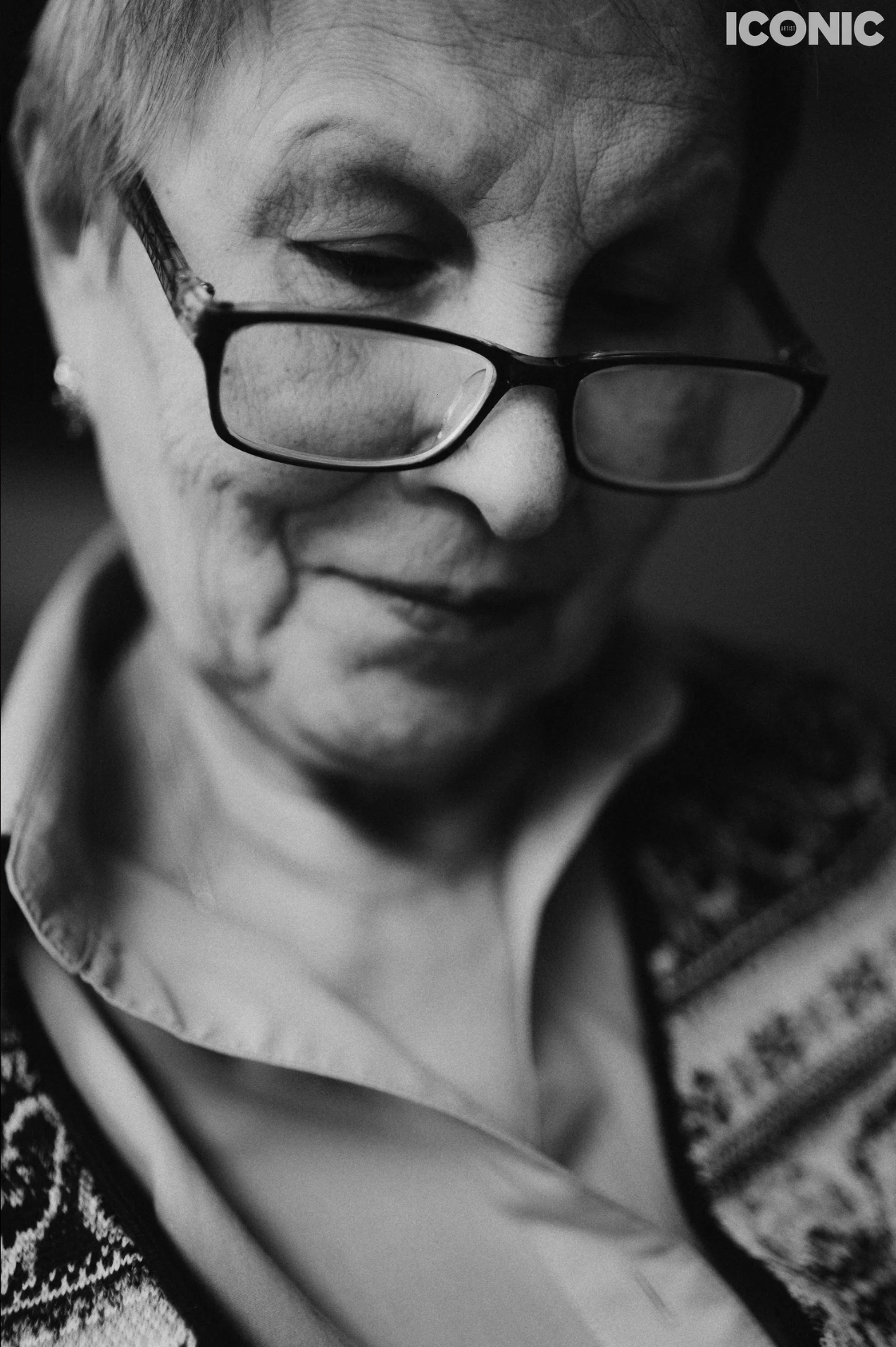 Black and white portrait of an elderly man with glasses, timeless family photography in Solihull.