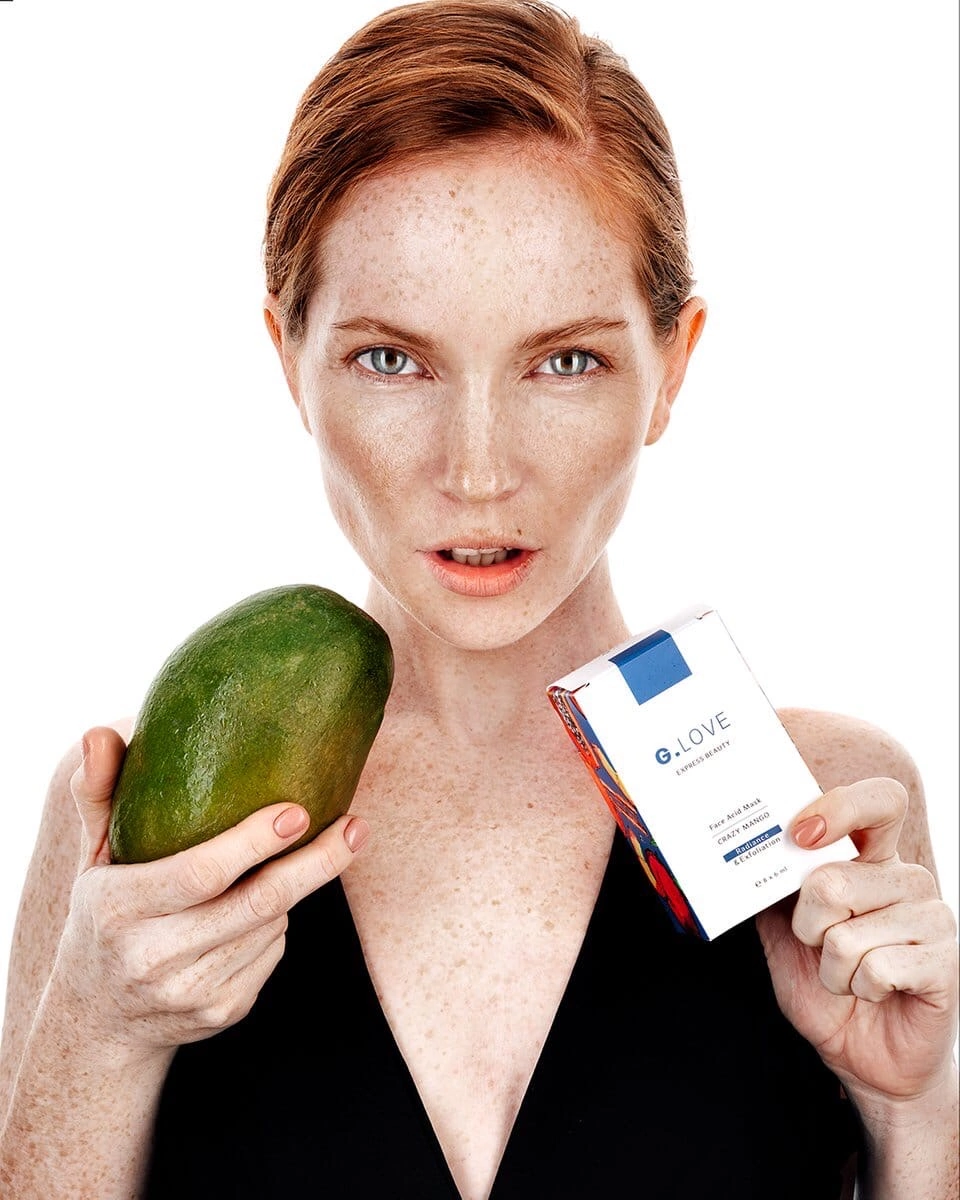 Profile of a model with her hair tied back, showcasing her sharp and defined facial features. The clean background puts the focus entirely on her profile, emphasizing her strong jawline and elegant neck. This photograph highlights the timeless beauty of simplicity and the power of a well-defined silhouette.