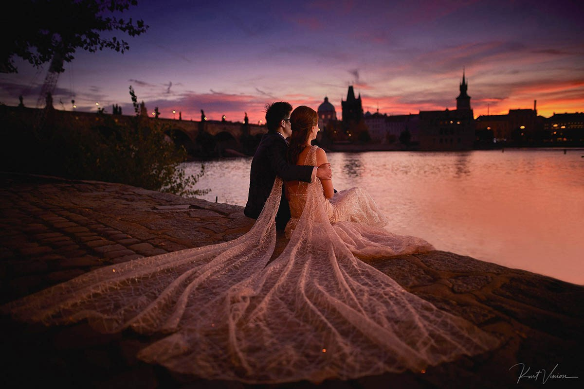 Couple sunrise Charles Bridge riverside Prague golden hour