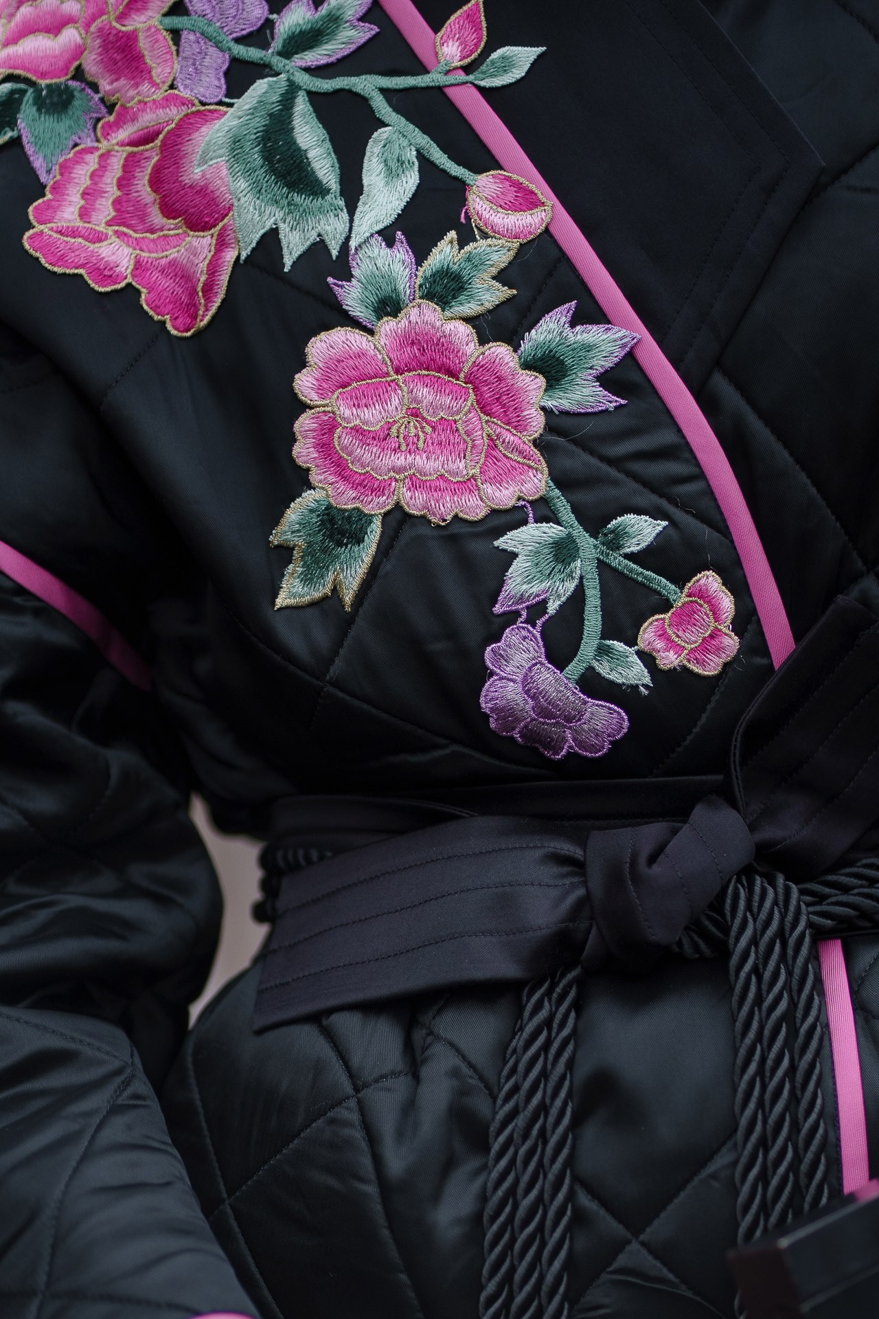 Close up of embroidered floral jacket detail at Pitti Uomo street style