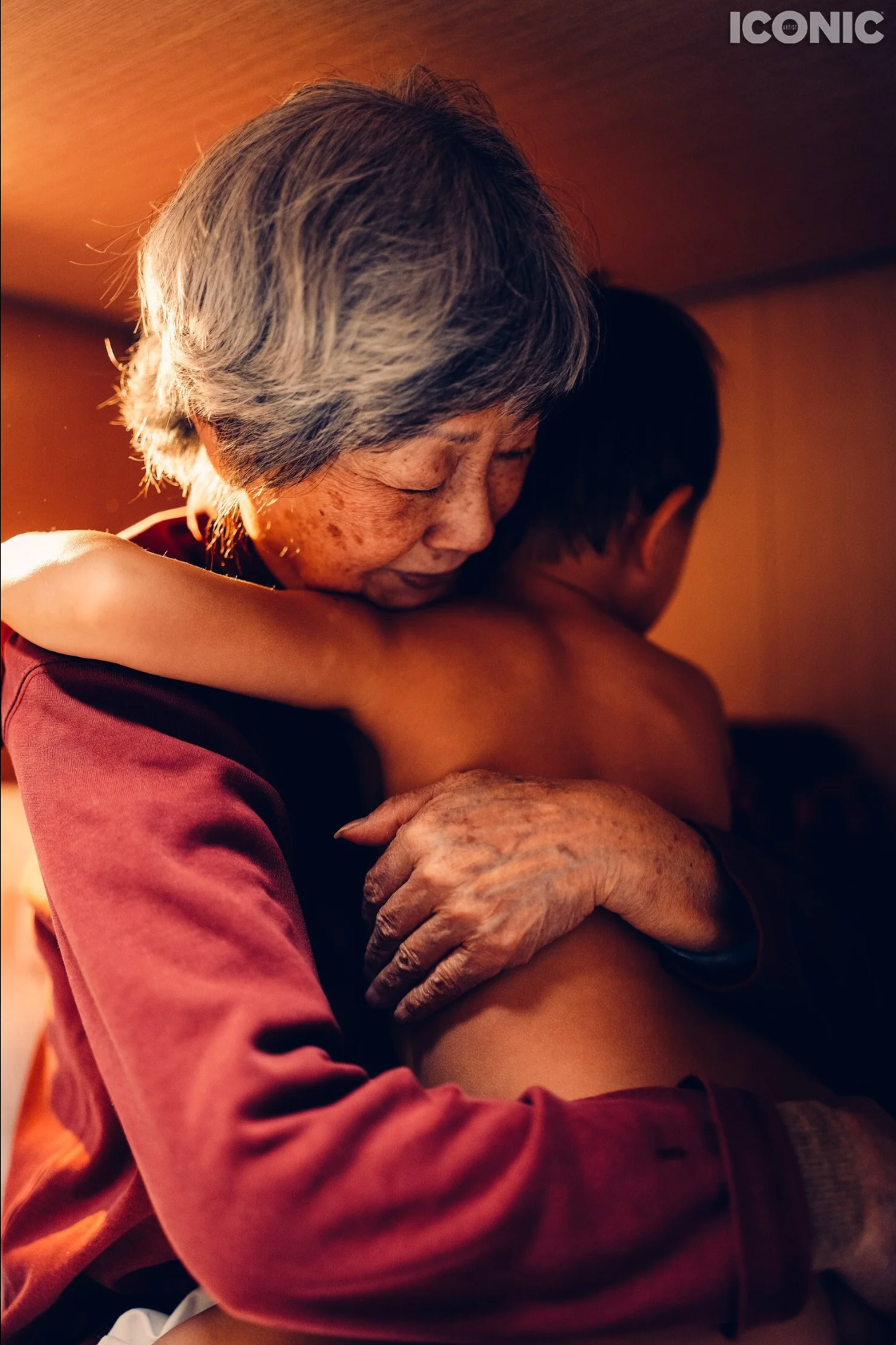 Tender moment between generations, warm family portrait photographed in Solihull.