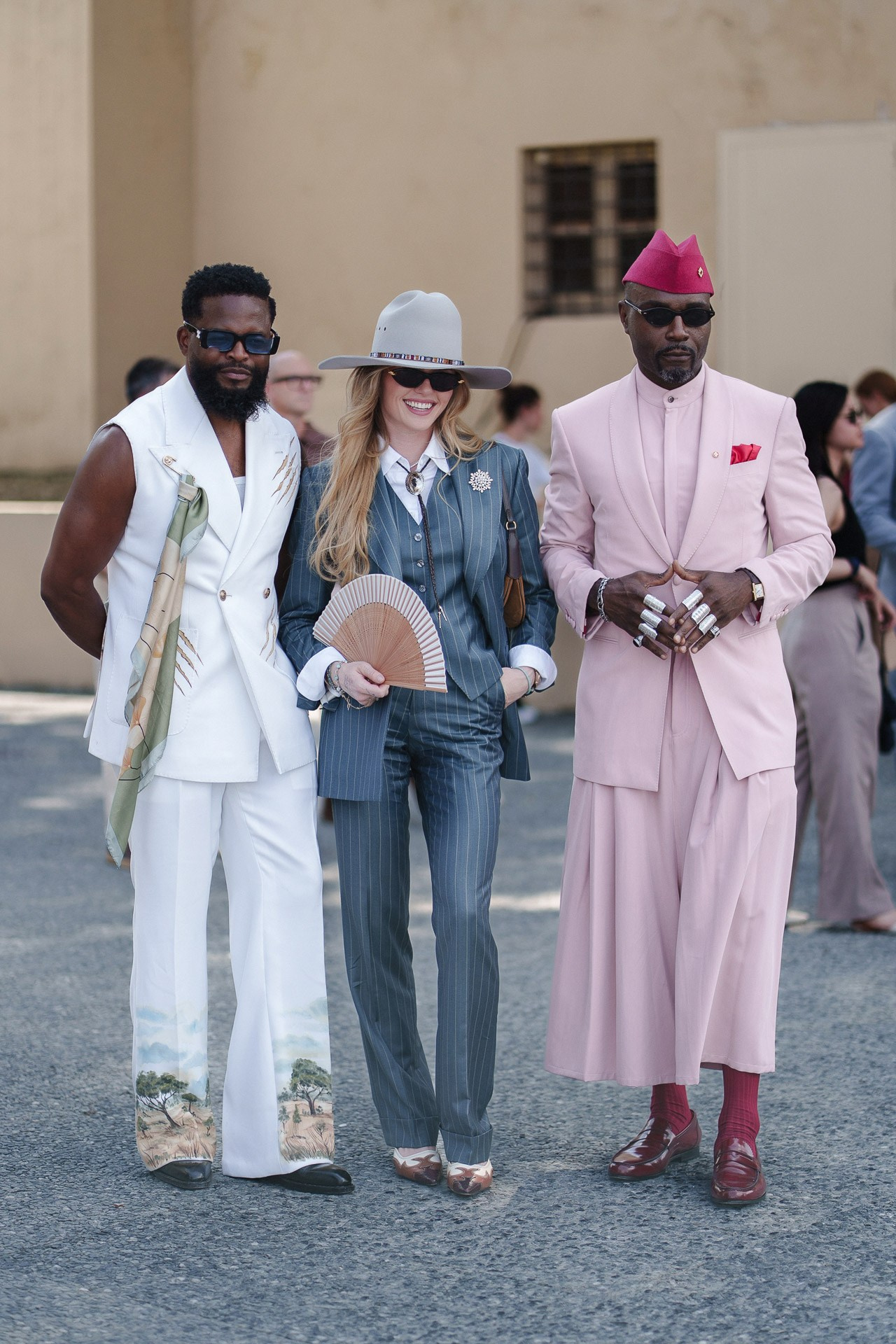 Fashion crowd at Pitti Uomo 110, guests in white, blue and pink summer tailoring