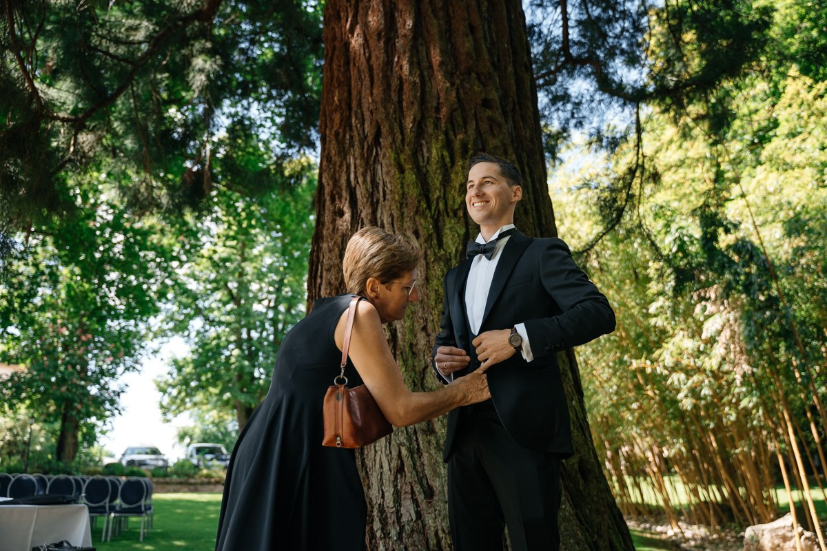 Groom preparing for a first look