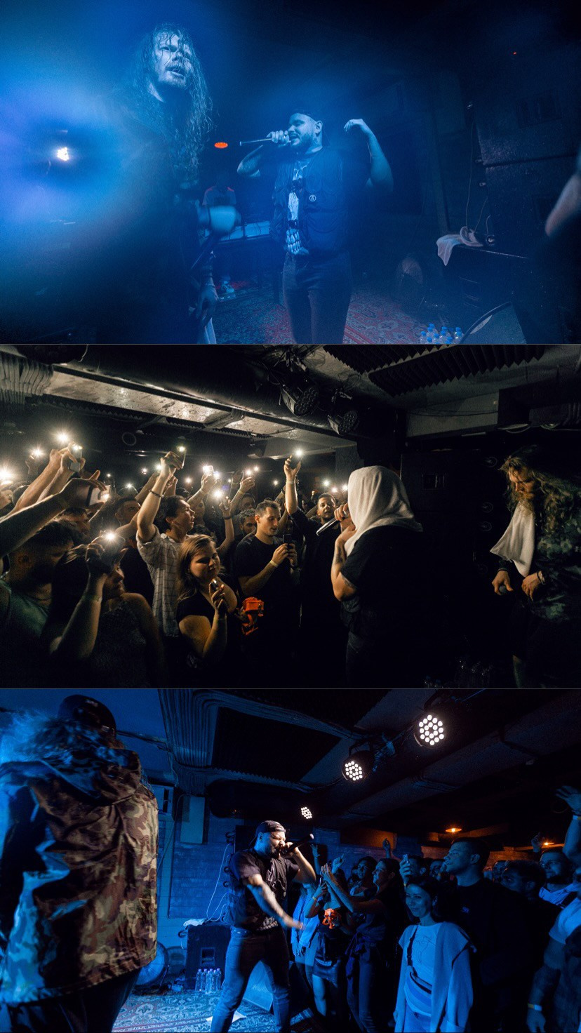 The silhouette of the lead singer's microphone against the backdrop of hazy stage lighting⁠