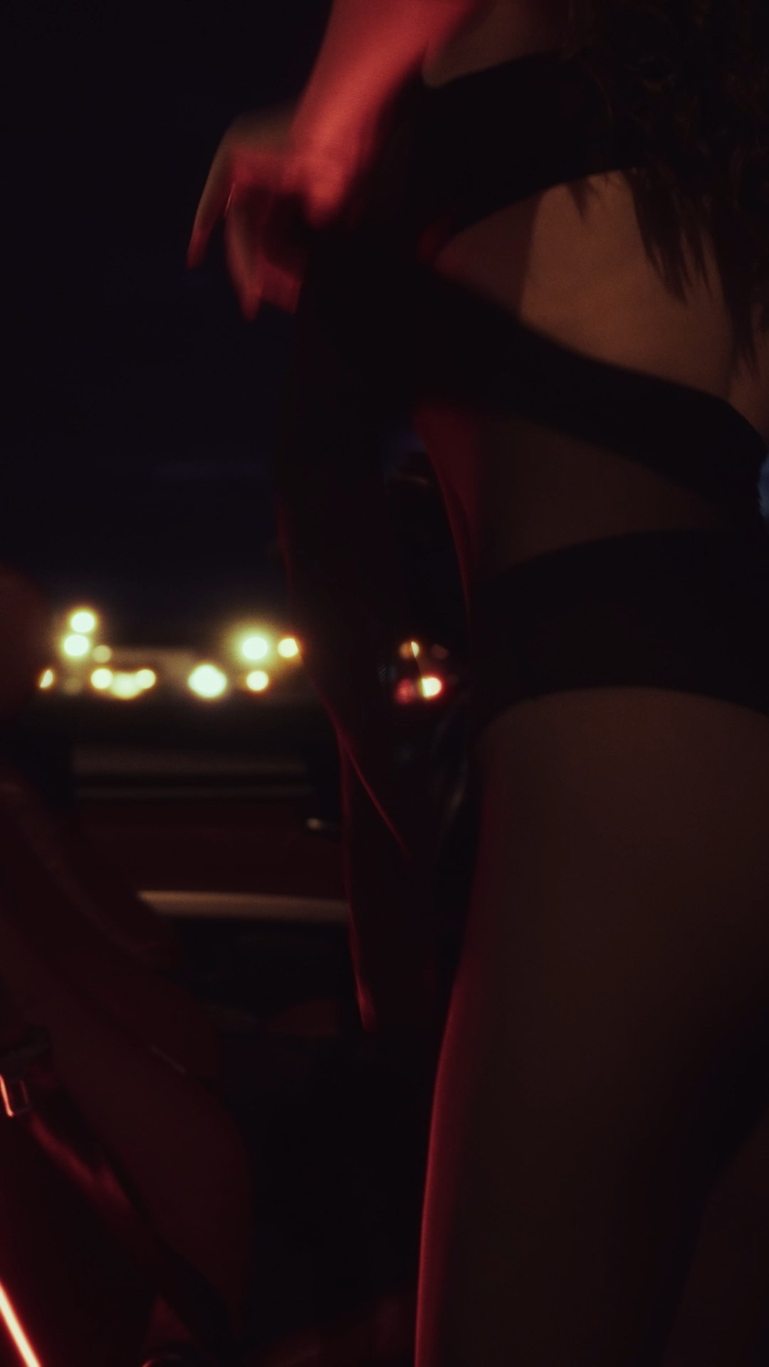 A dimly lit close-up of a person in motion, wearing dark clothing, with the warm glow of city lights in the blurred background creating a dynamic and mysterious atmosphere.