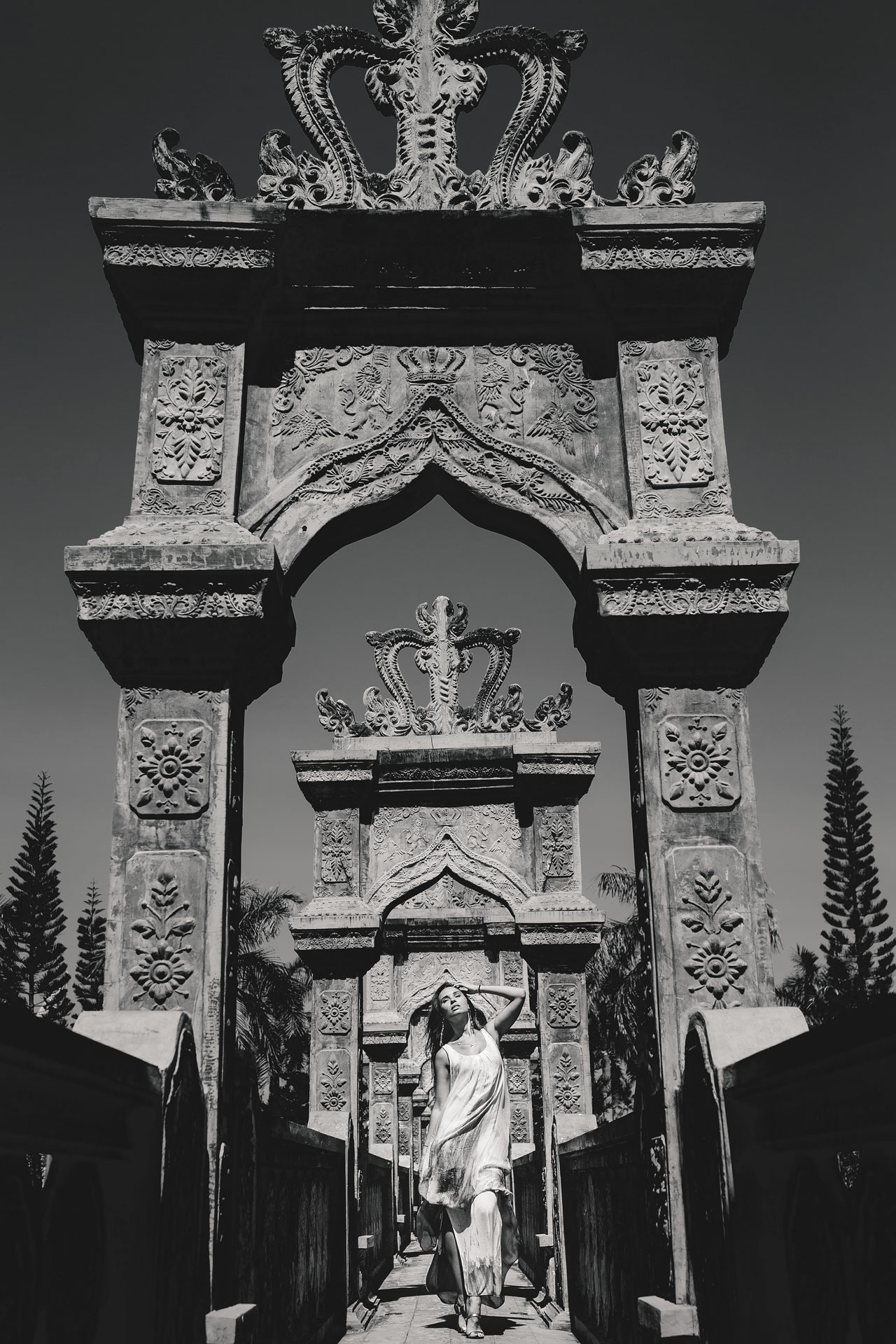 lady is posing in front of the kings temple at Bali island