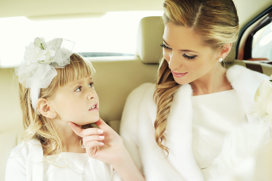  Bride and flower girl sharing a tender moment – wedding photography in Amsterdam, Netherlands.