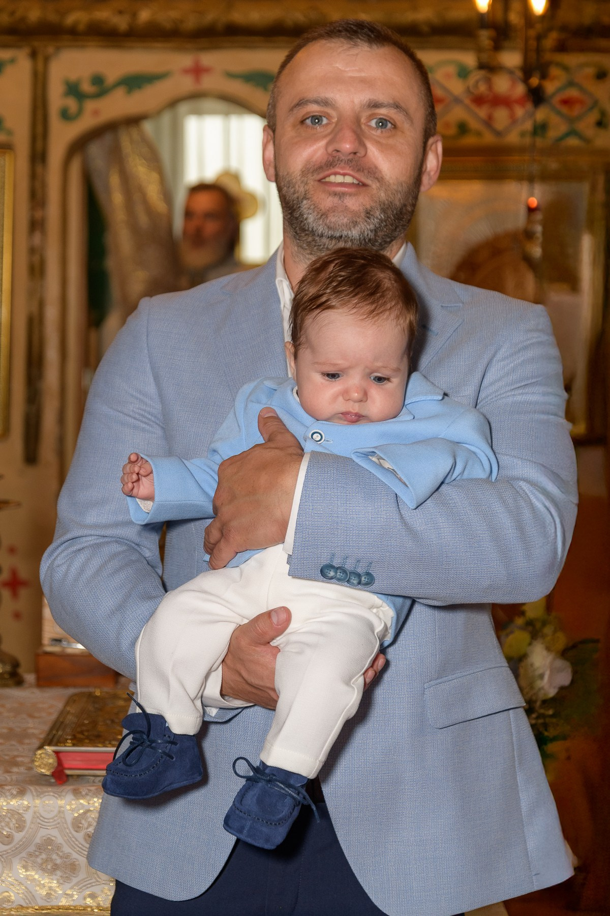 The Christening of Alexandru. Hand for photos