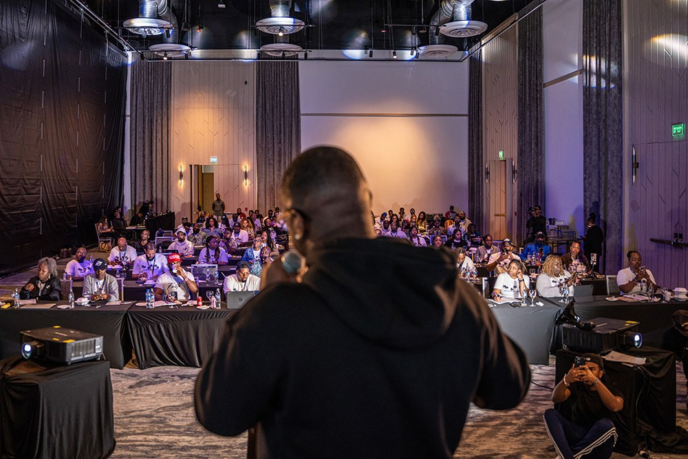 Corporate speaker delivering talk to engaged audience members.