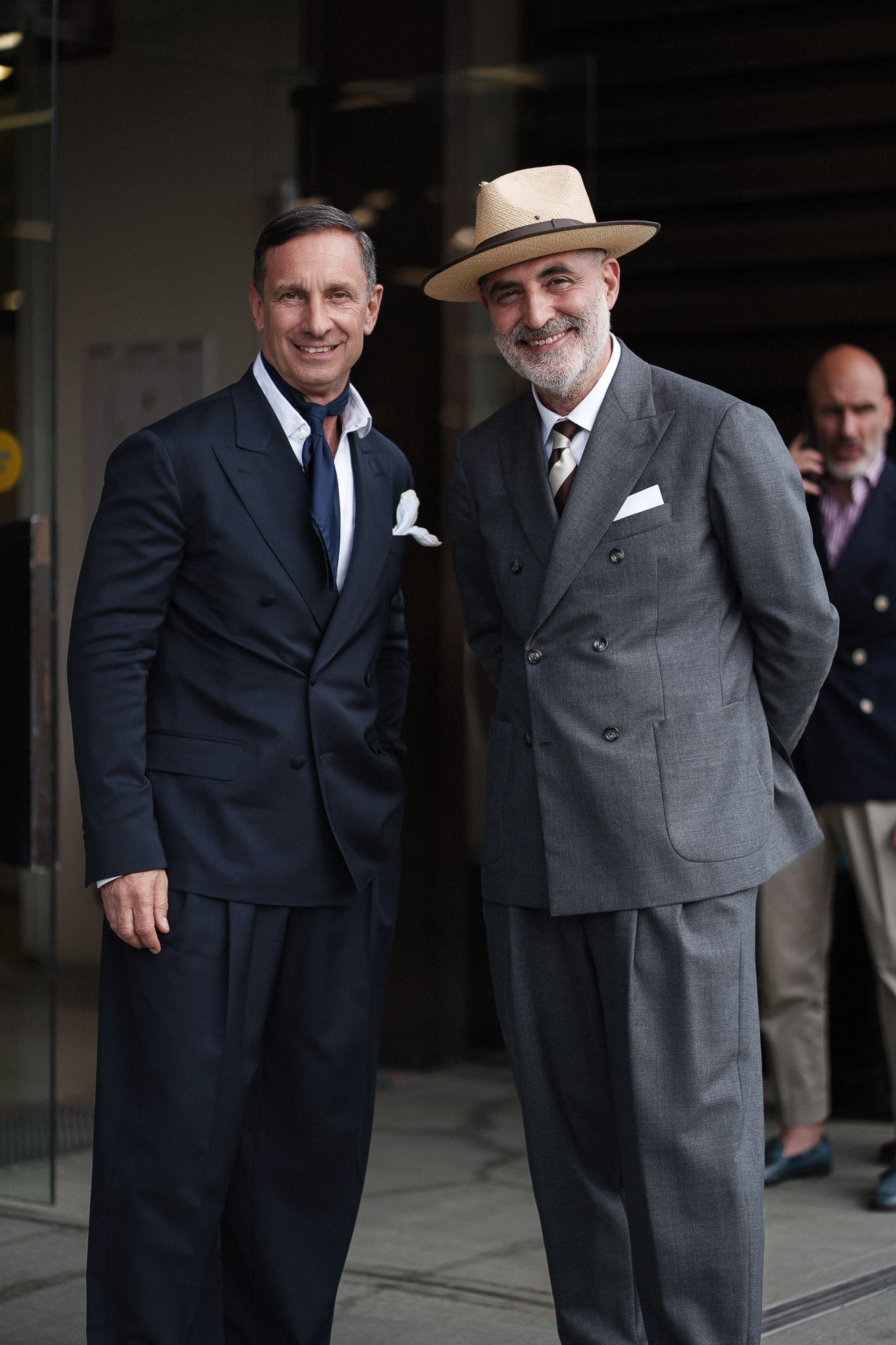 Pitti Uomo 110 portrait of two menswear guests in classic dark and grey tailoring