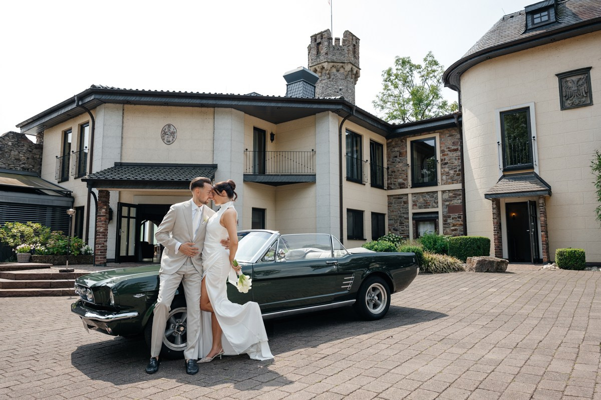 bride and groom with old timer