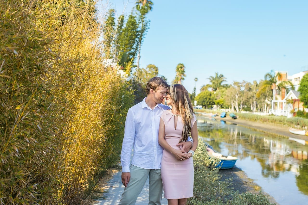 Romantic moment captured during an engagement session at the Venice Canals, LA