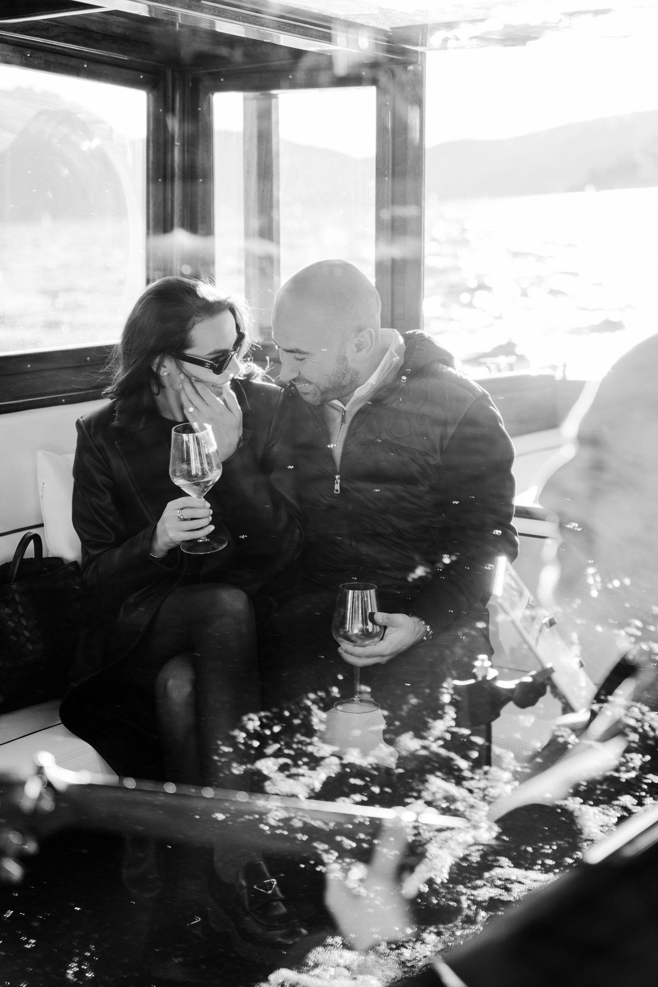 Couple enjoying a private boat ride on Lake Como