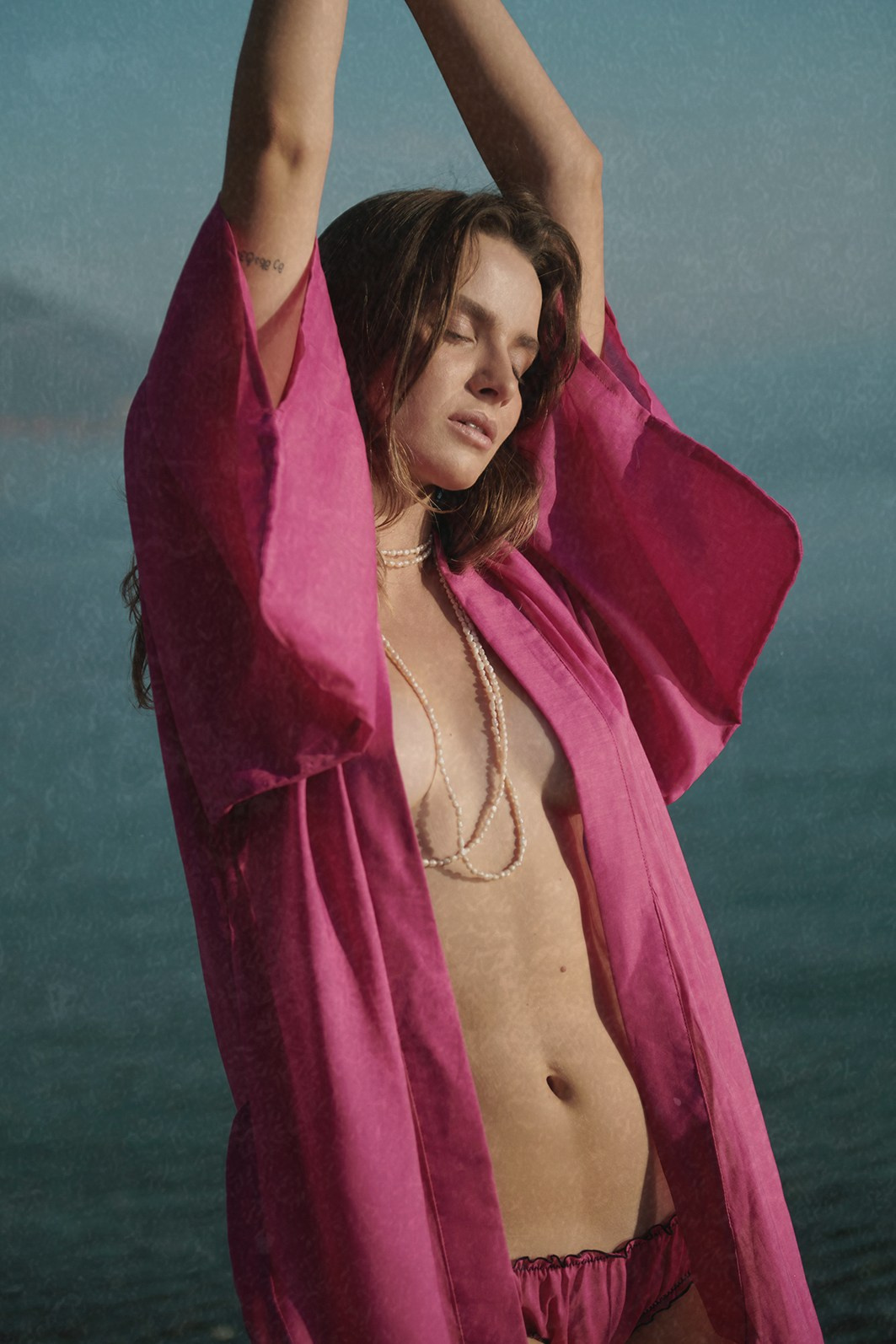 Editorial campaign for a beachwear brand, captured on the seashore in natural light