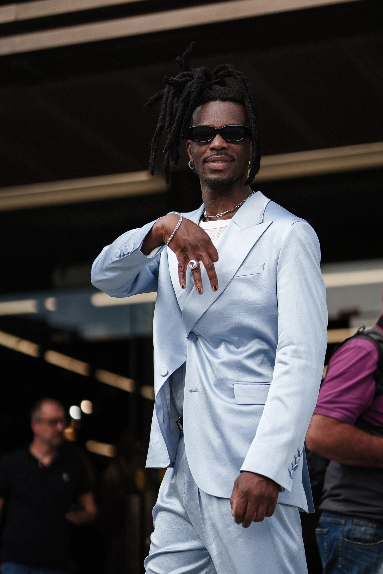 Pitti Uomo 110 street style portrait, guest in pale blue suit and sunglasses outside the fair