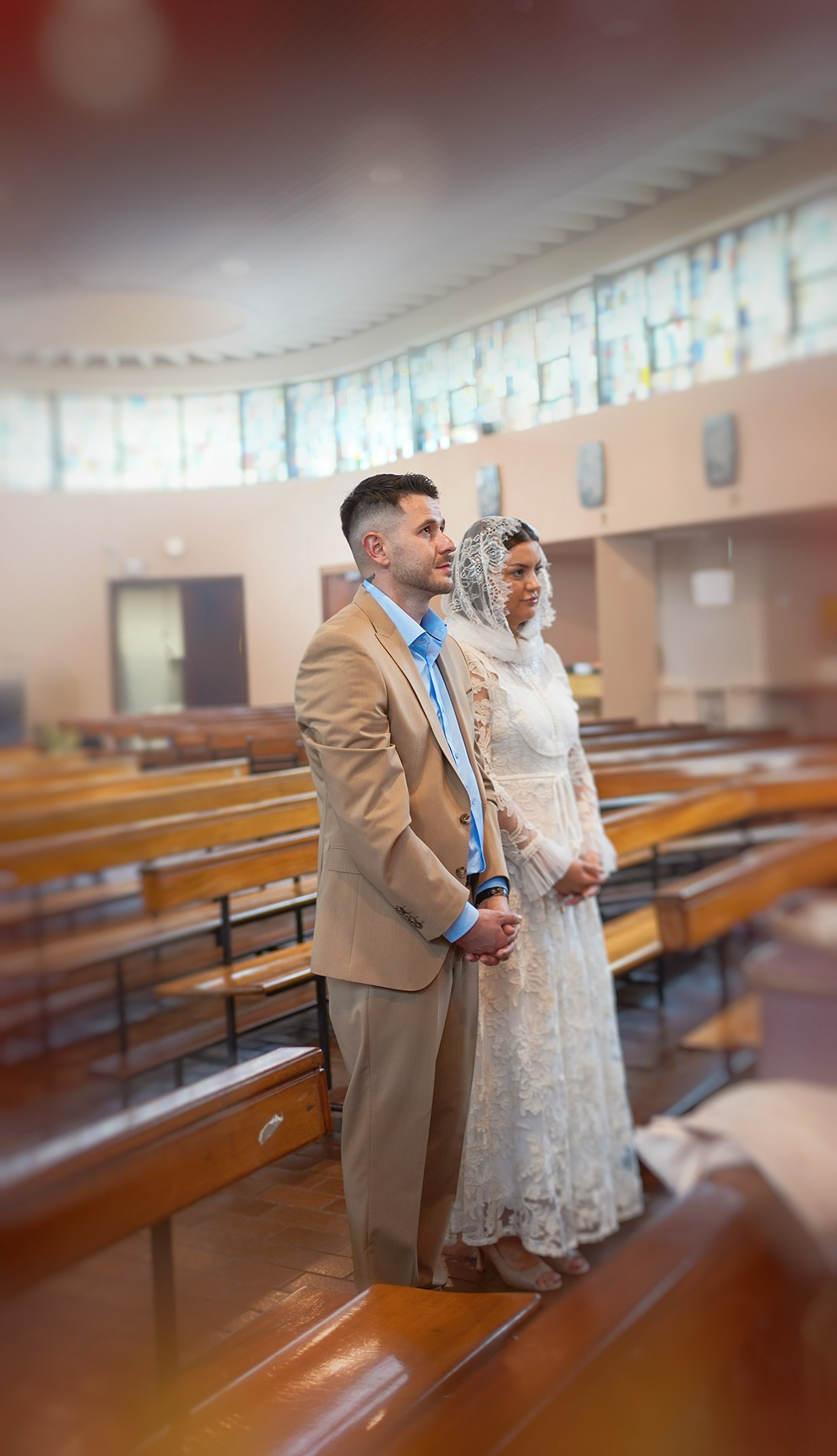 Parents standing inside the church during the Munster baptism ceremony.