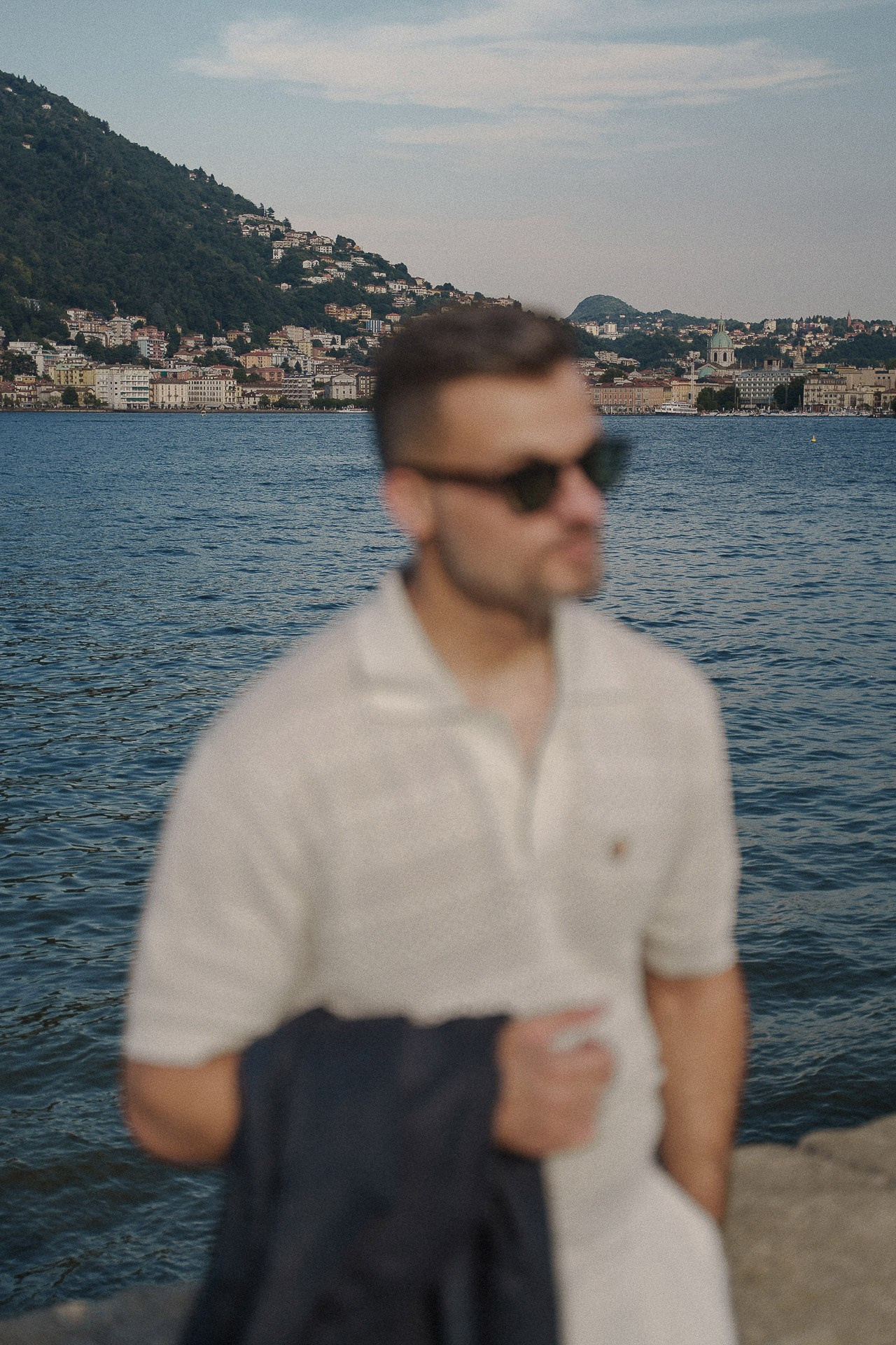 Male portrait by Lake Como with waterfront views