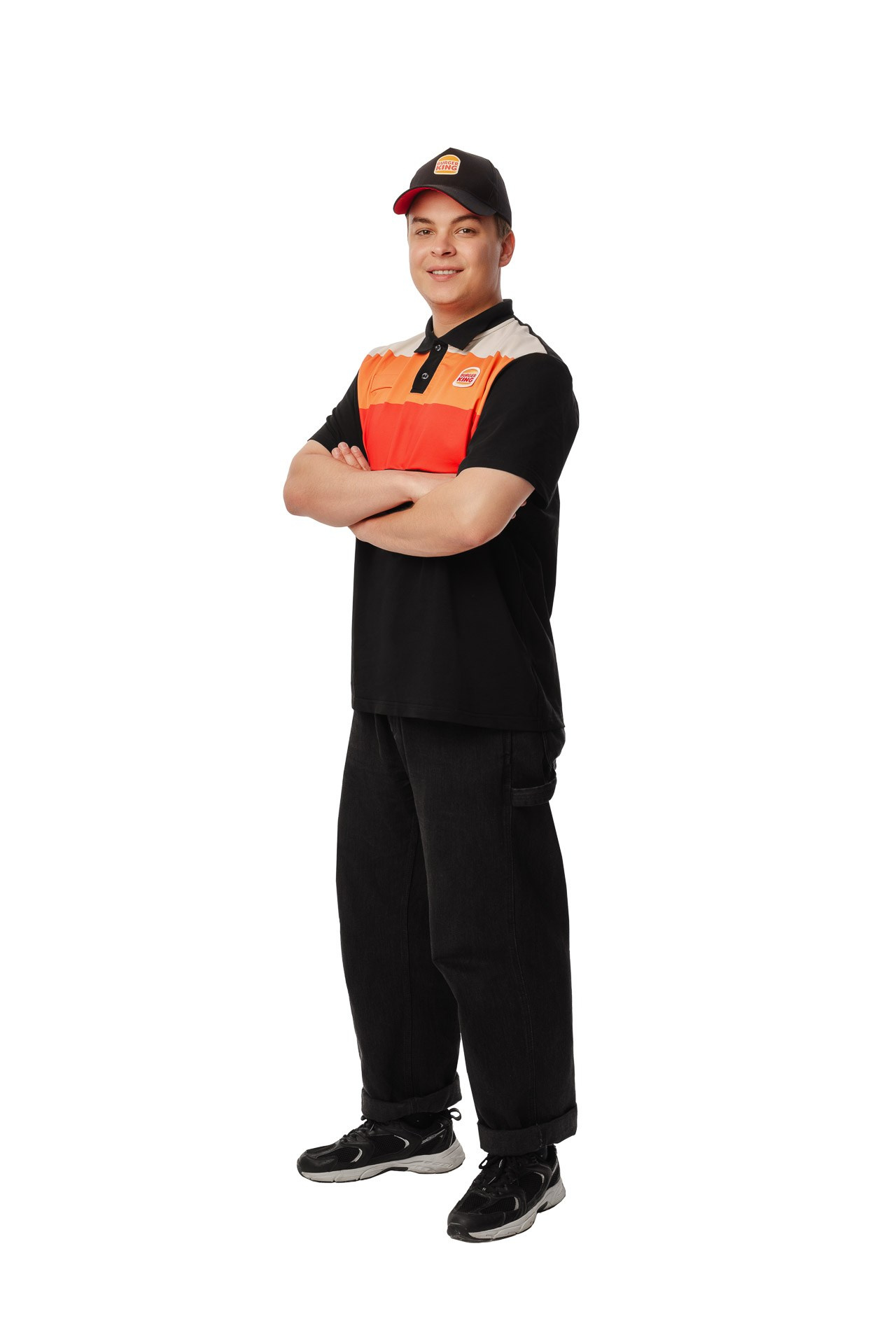 Burger King crew member standing with arms crossed, full body studio portrait