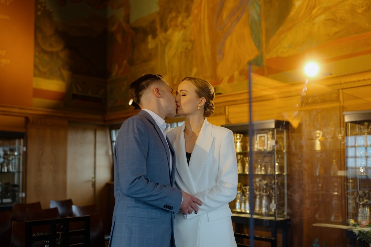 first kiss of bride and groom as couple