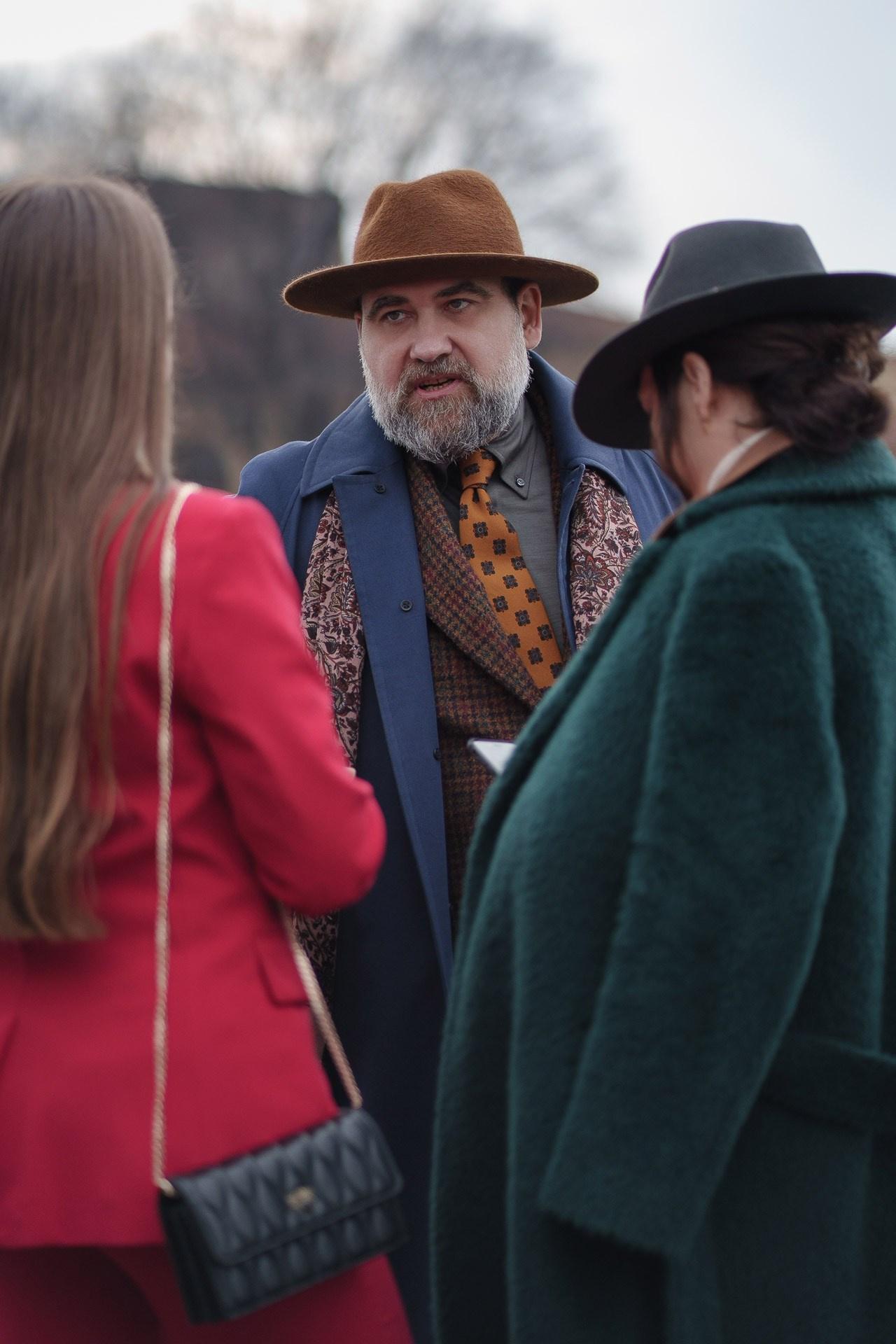 Fashionable people talking together during Pitti Uomo 109 Florence