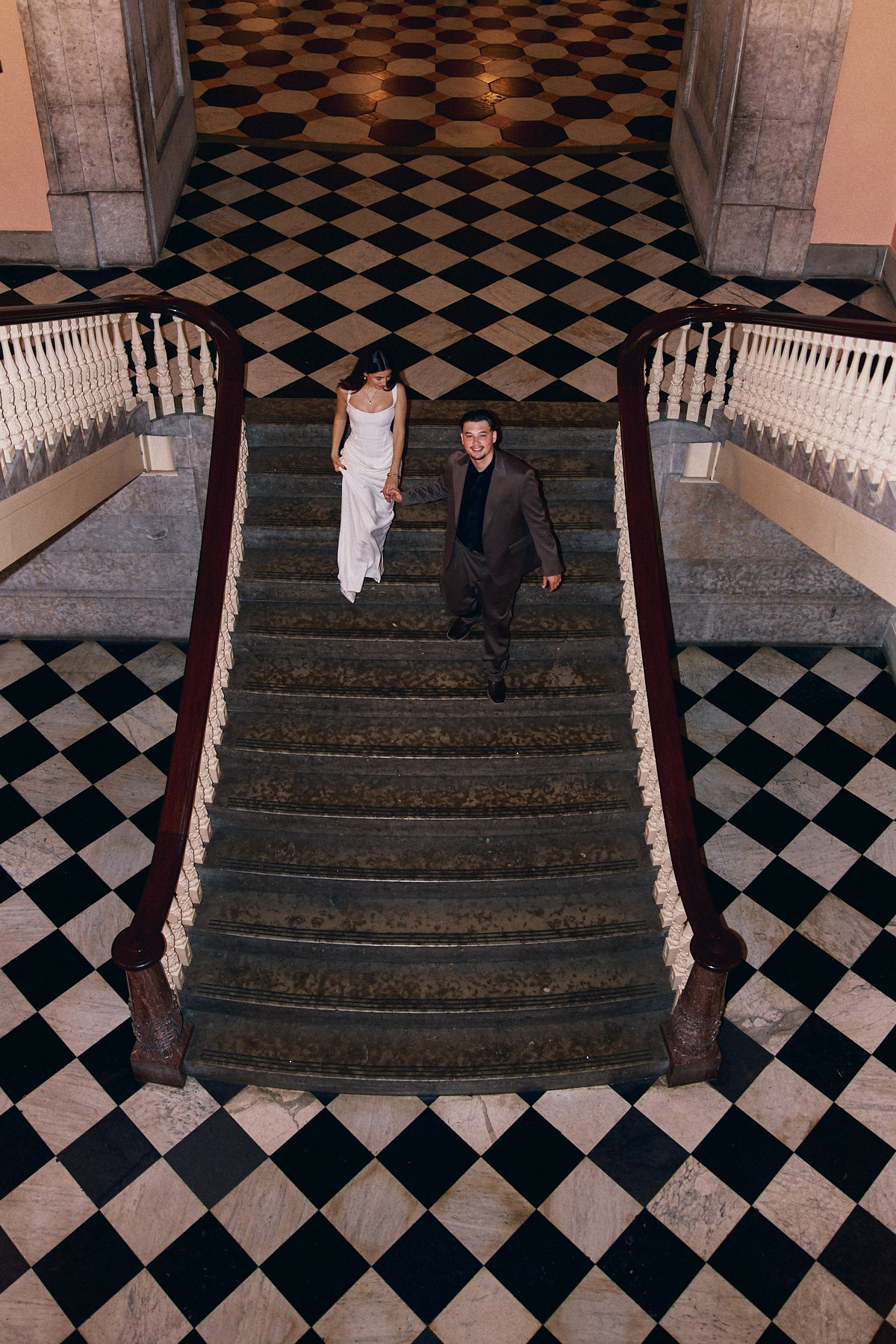 Top-down view of a couple on checkered stairs at the Ohio Statehouse, Ohio
