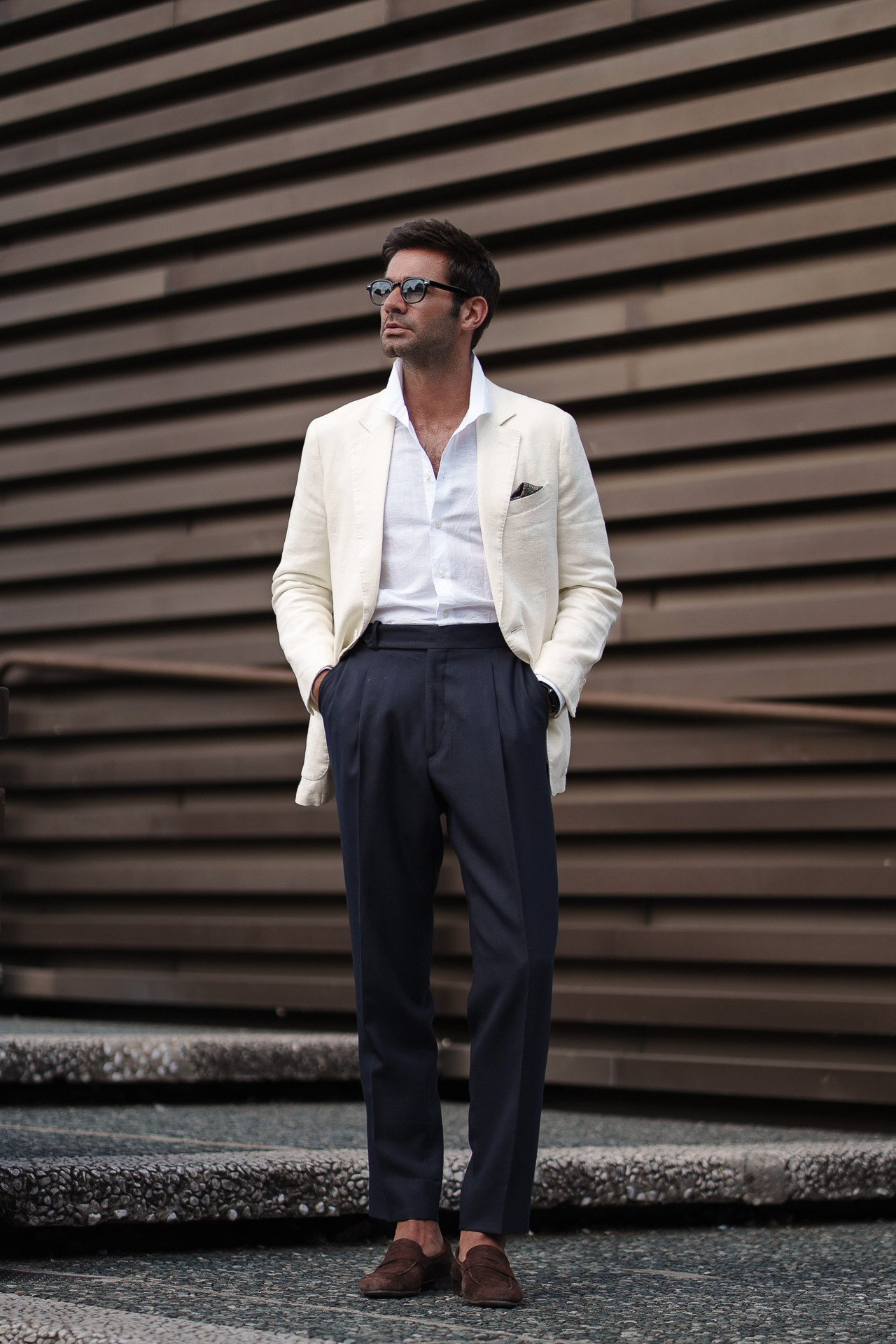 Pitti Uomo 110 menswear portrait, guest in white blazer, navy trousers and open shirt