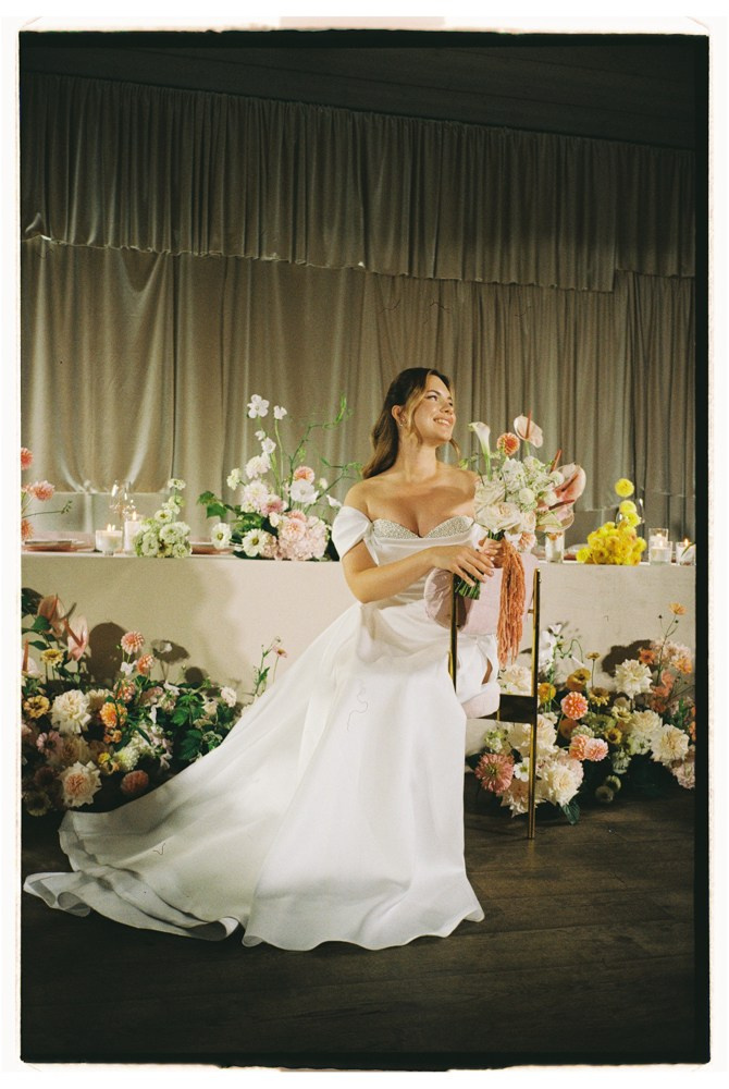 Bride dancing on stage during luxury wedding reception