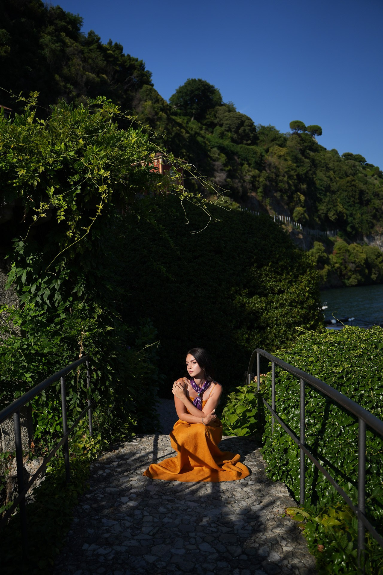 Woman posing in a historic garden at Lake Como