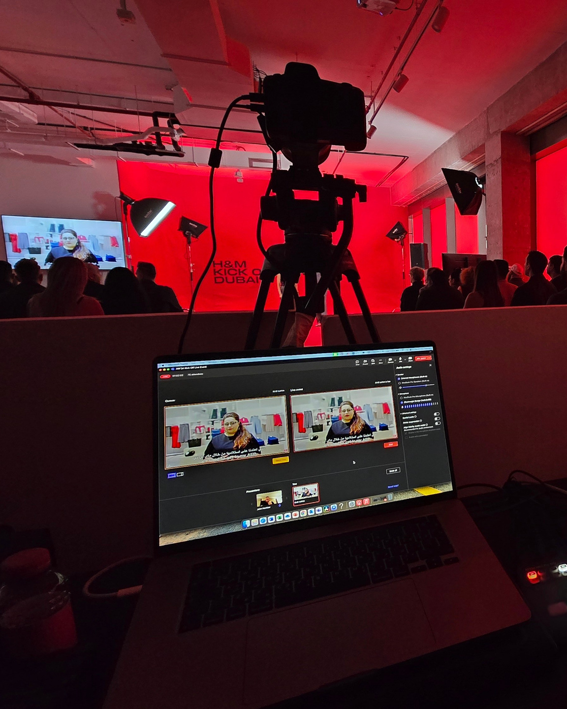 Live broadcast control setup with cameras and monitors during a corporate event
