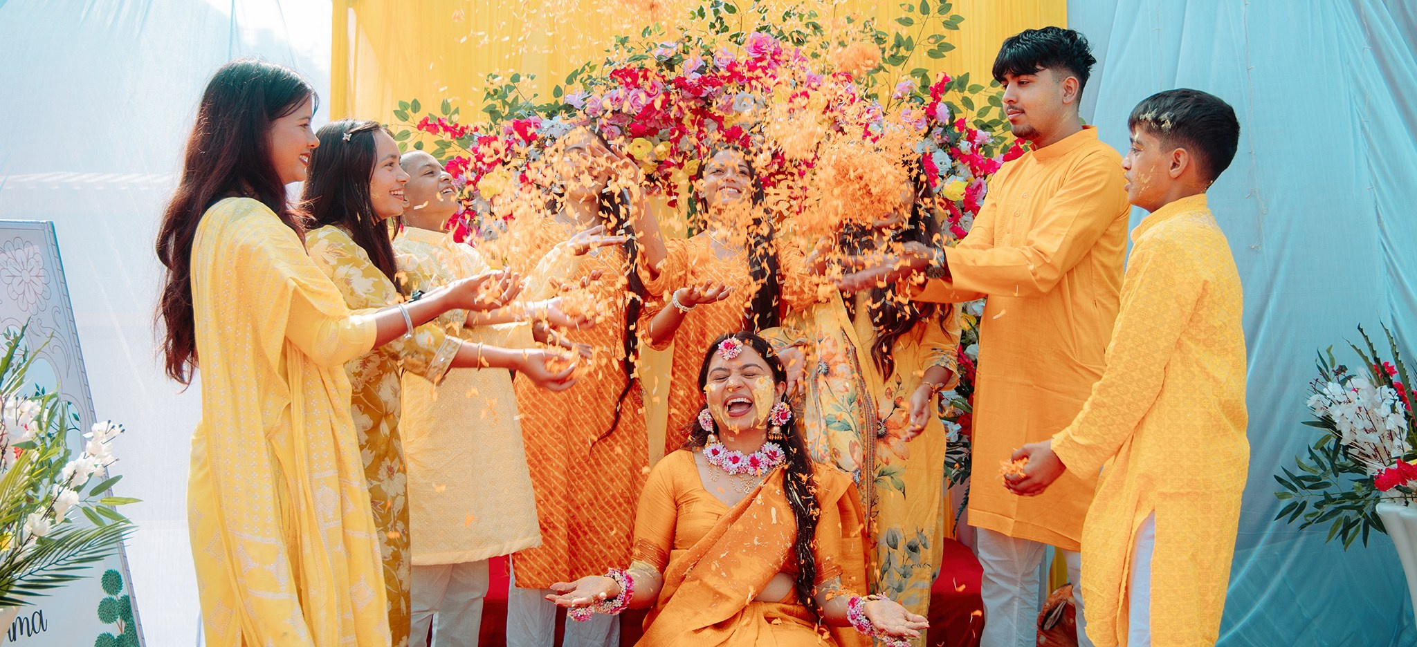 Traditional Haldi ceremony celebration with flower petals at a Nepali wedding