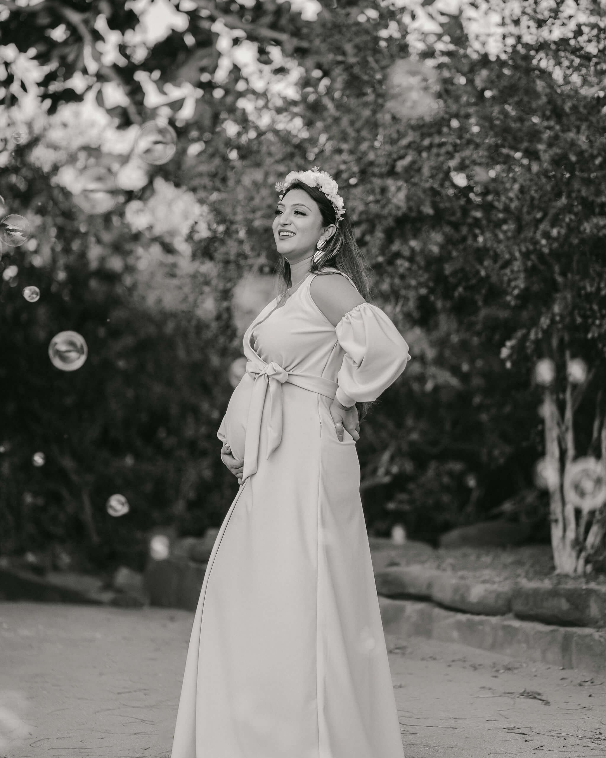 Classic B&W pregnancy portrait of mom in boho style dress, captured Mombasa, Kenya.