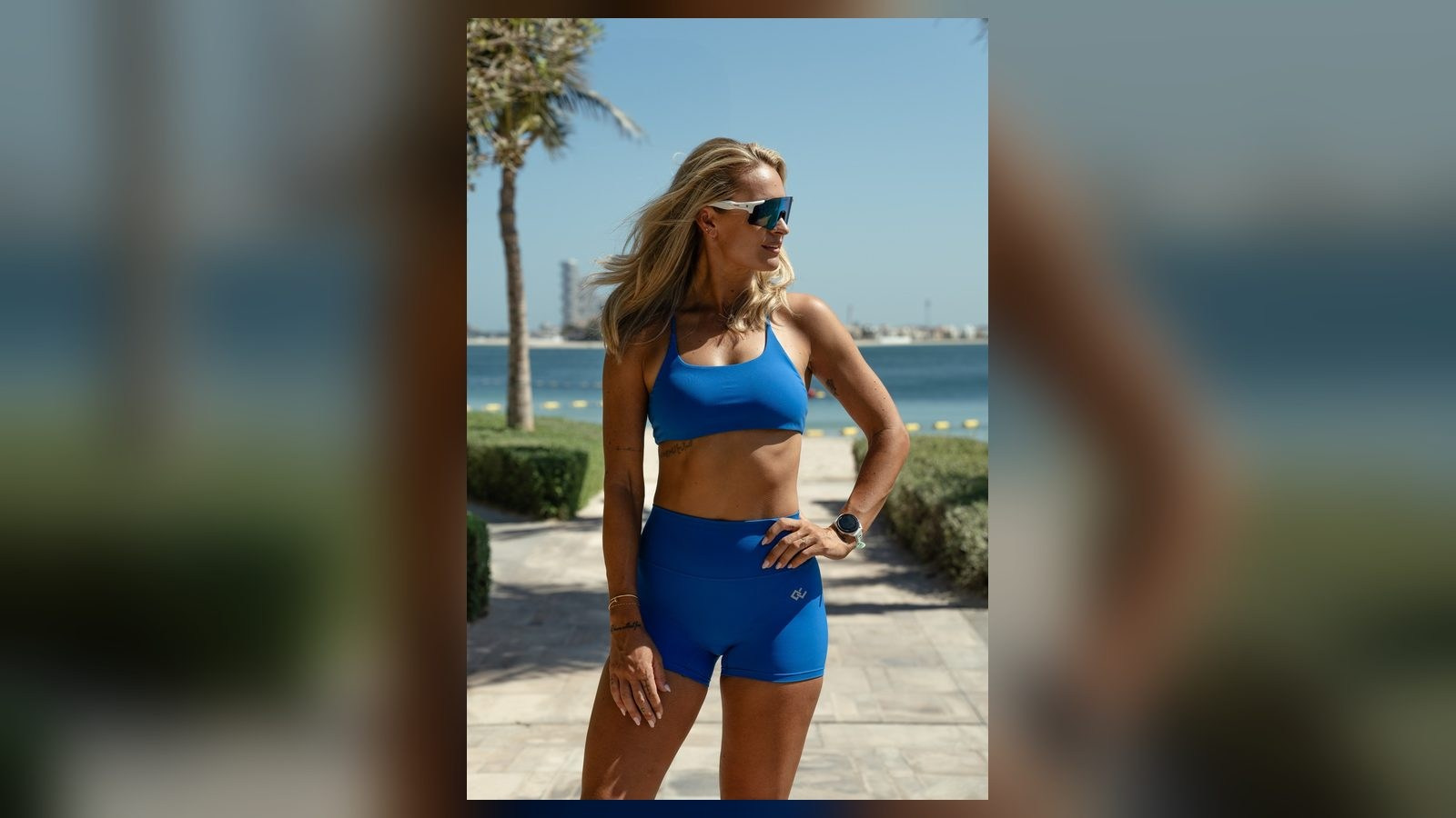 Fashion model in blue sportswear photographed outdoors for a lifestyle campaign