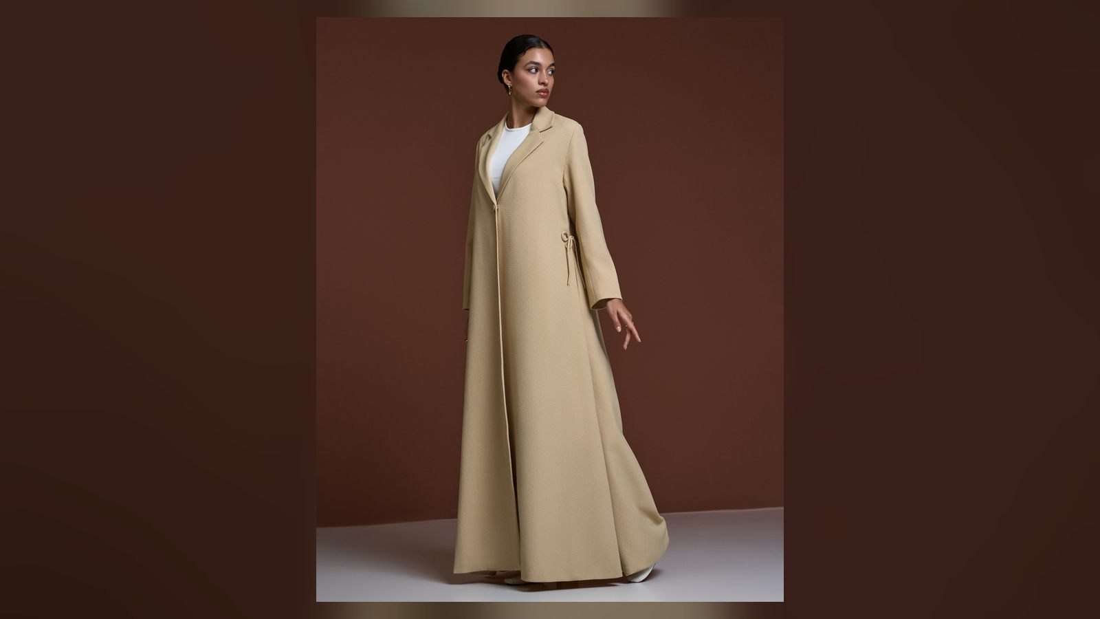 Beige fashion garment photographed under controlled studio lighting for accurate ecommerce colour