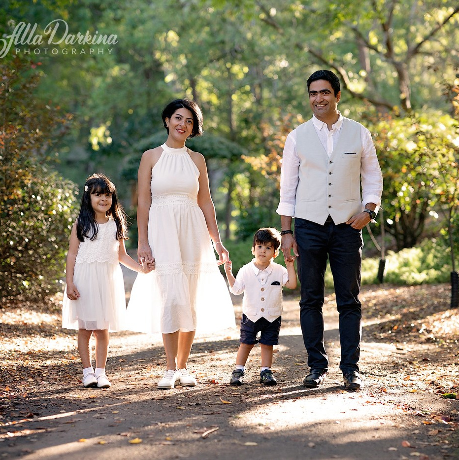 A happy family captured by Alla Darkina Photography during an outdoor photo session.
