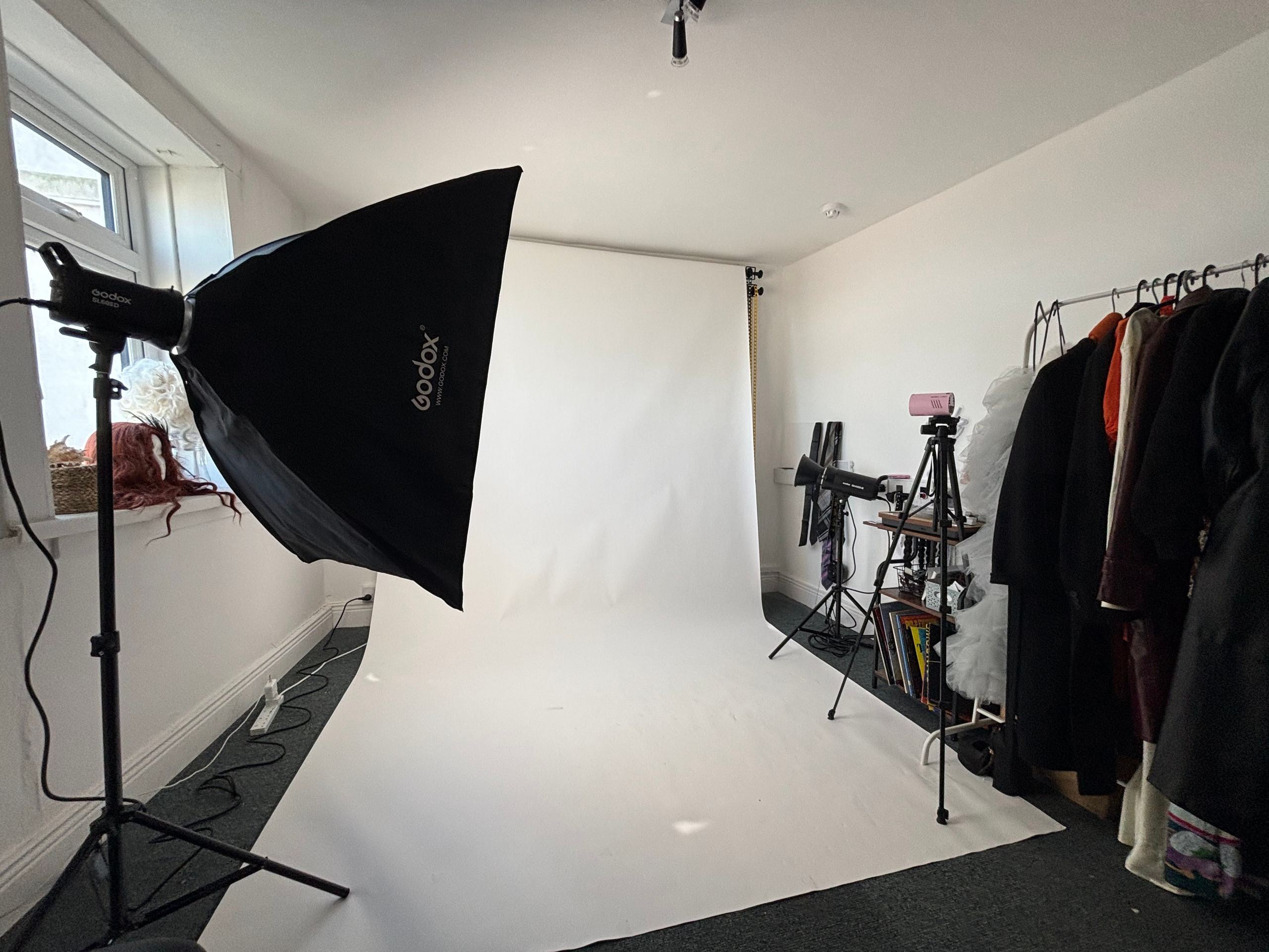 Fully equipped photography studio in Wexford with black backdrop, wardrobe rack and Godox studio lighting available to rent